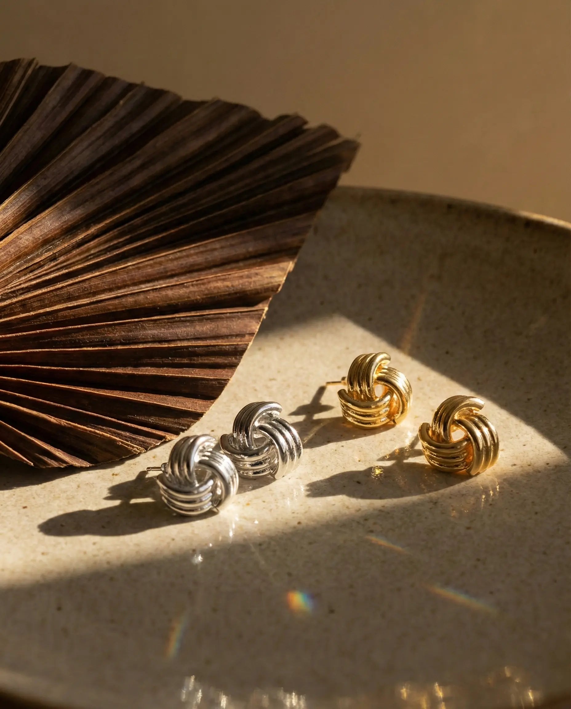 anti-tarnish-gold-pvd-samira-earrings-detail, radiant-textured-shimmer-jewelry, jewelry-for-sensitive-ears-316l-steel, upscale-jewelry-brand-denmark, modern-classic-knot-design