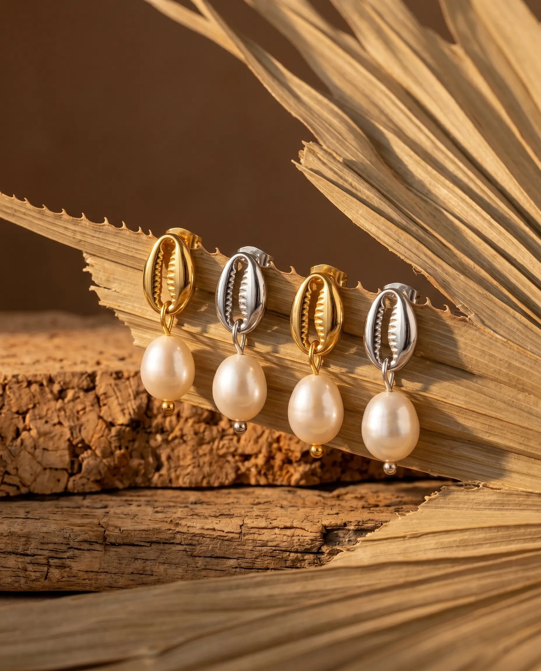ava-linear-drop-studs-displayed-on-natural-texture-minimalist-jewelry-photography-for-senya