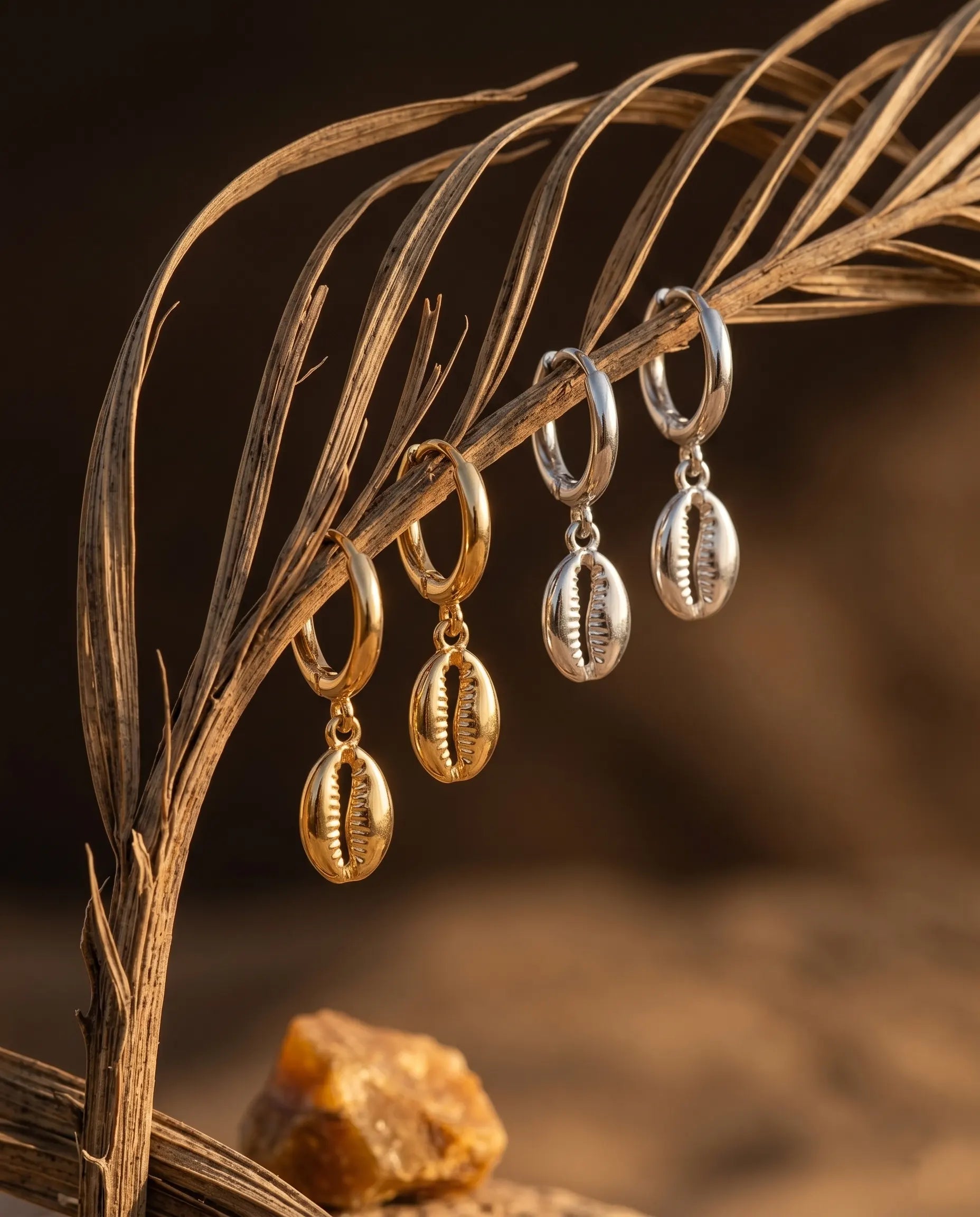 close-up-detail-of-sand-cowrie-shell-earrings-showcasing-high-polish-finish-and-seamless-hinge-closure-hypoallergenic