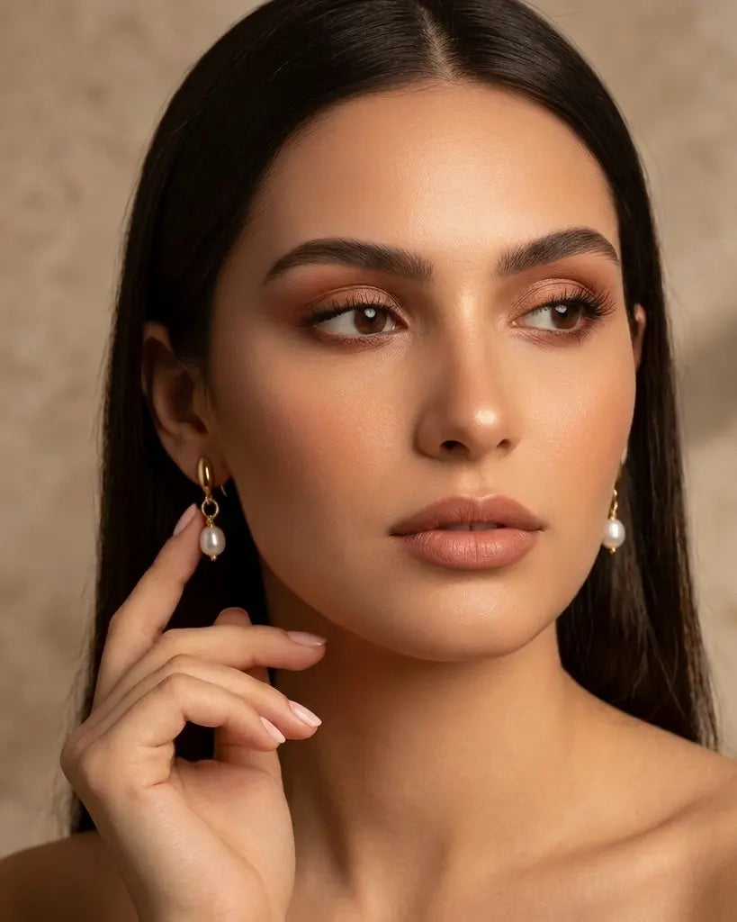 closeup-front-view-model-wearing-gold-petal-pearl-earrings, glowing-elegant-daily-wear-gold-jewelry-europe, luxury-women-professional-jewelry, feminine-architectural-statement-studs