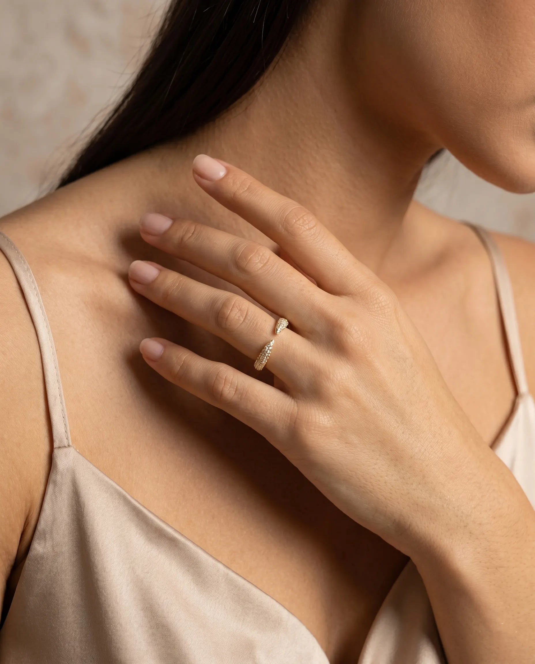 closeup-hand-view-model-wearing-silver-tear-pave-ring, glowing-elegant-daily-wear-silver-jewelry-europe, luxury-women-professional-jewelry, feminine-architectural-adjustable-ring