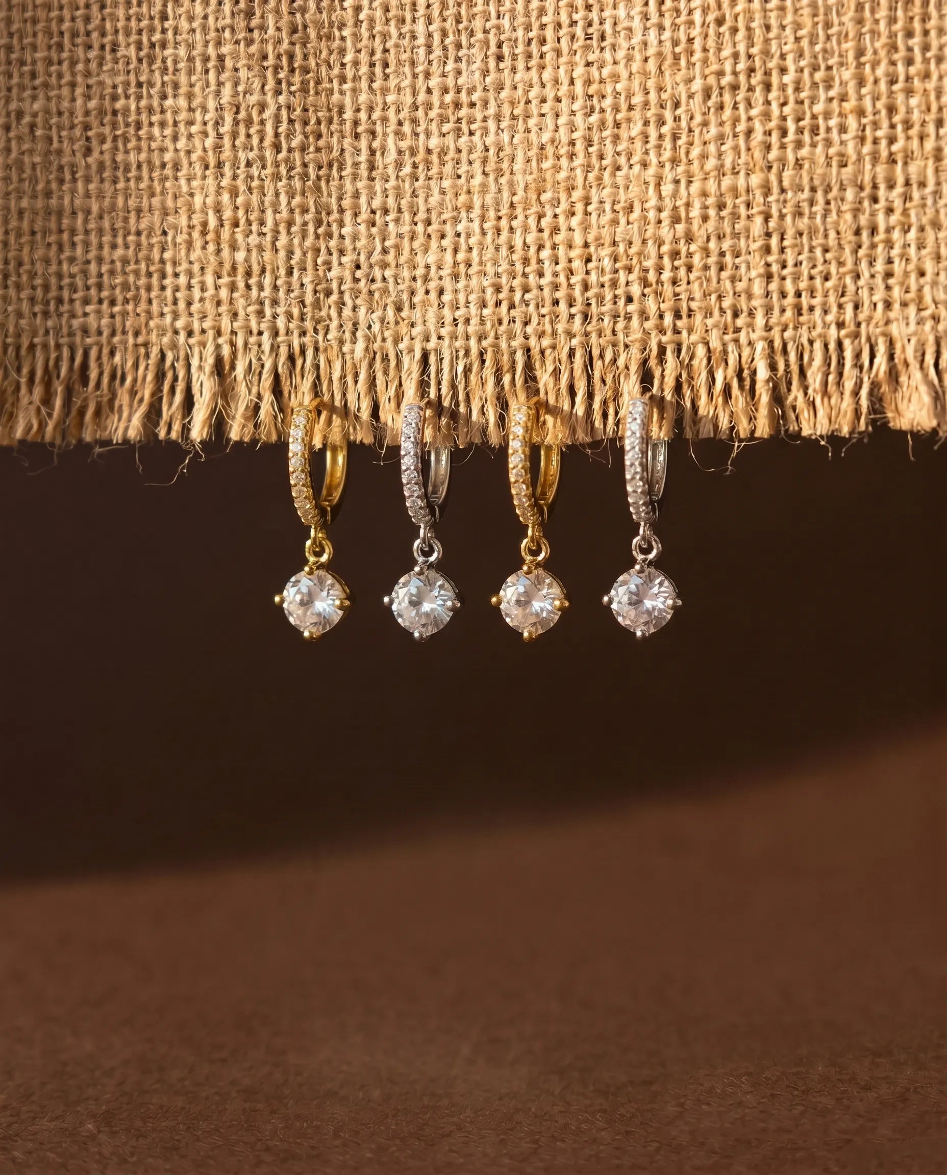 dafne-zirconia-drop-huggie-earrings-925-sterling-silver-gold-vermeil, elegant-minimalist-solitaire-dangle-jewelry-luxury, high-quality-tarnish-free-shimmering-crystal-hoops, senya-jewelry-best-seller-dafne