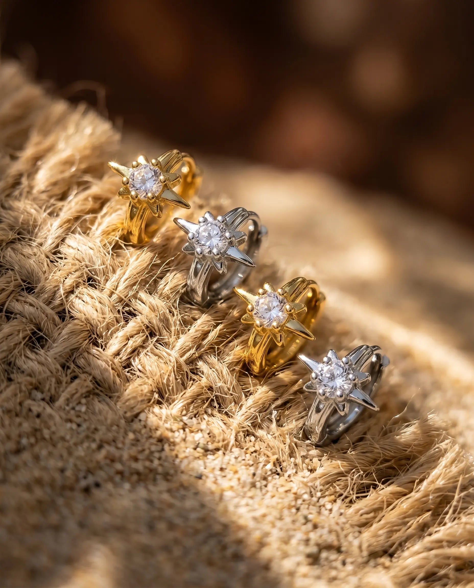elanor-star-huggie-hoops-displayed-with-natural-elements-minimalist-jewelry-photography-for-senya