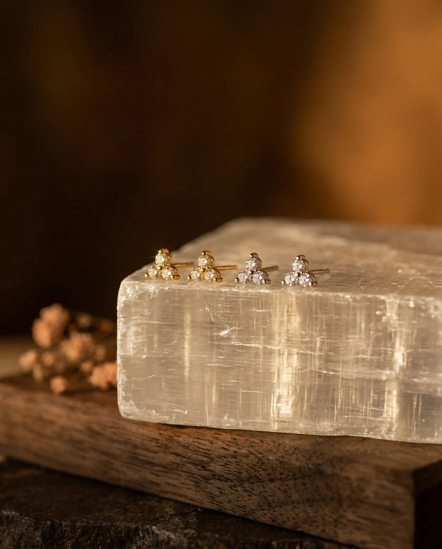 minimalist-ear-stack-foundation-blossom-earrings, natural-stone-jewelry-display-aesthetic, high-end-silver-gold-studs-showcase, sustainable-brand-presentation
