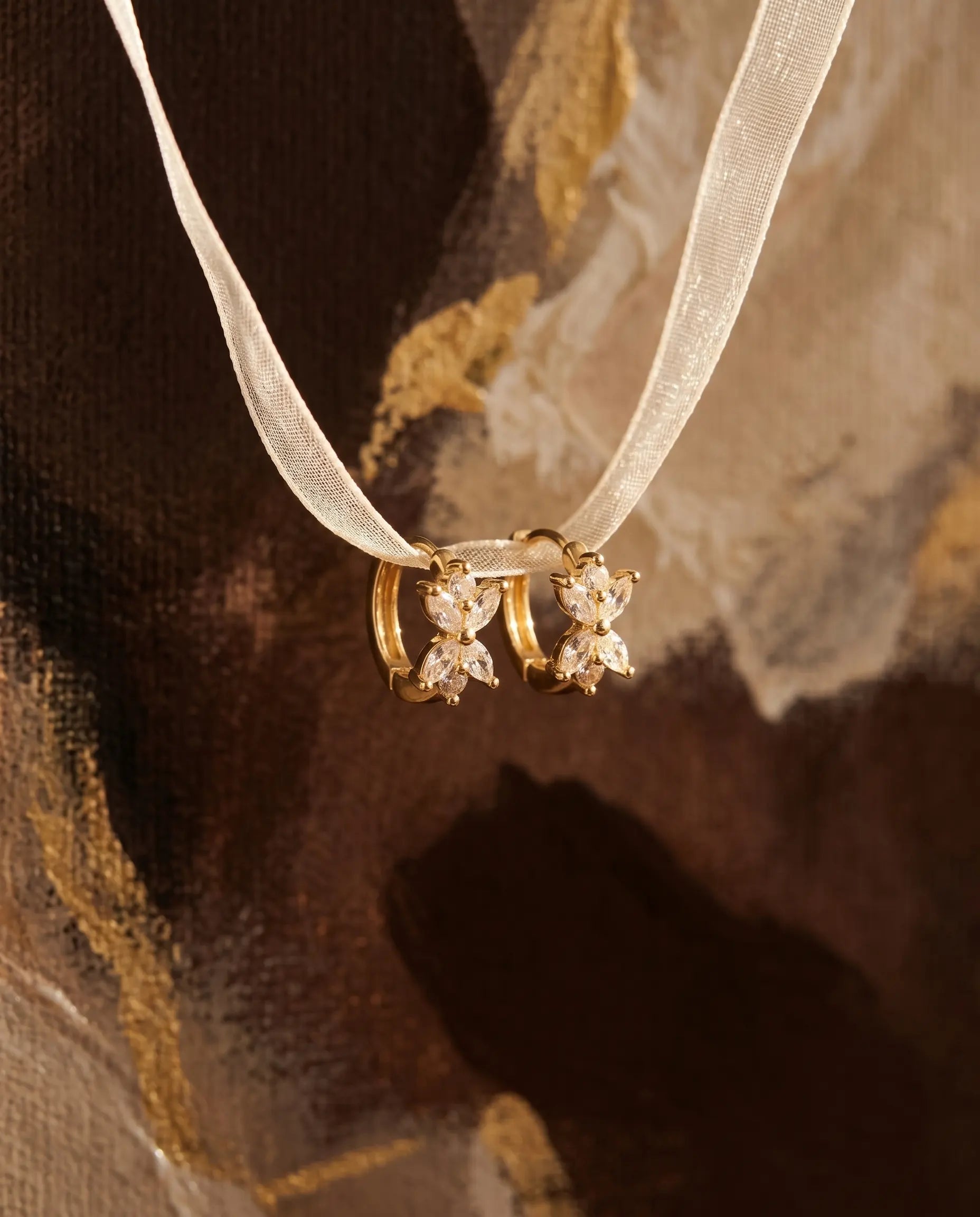 mirabel-butterfly-earrings-adorned-with-zirconia-on-delicate-ribbon-minimalist-jewelry-photography