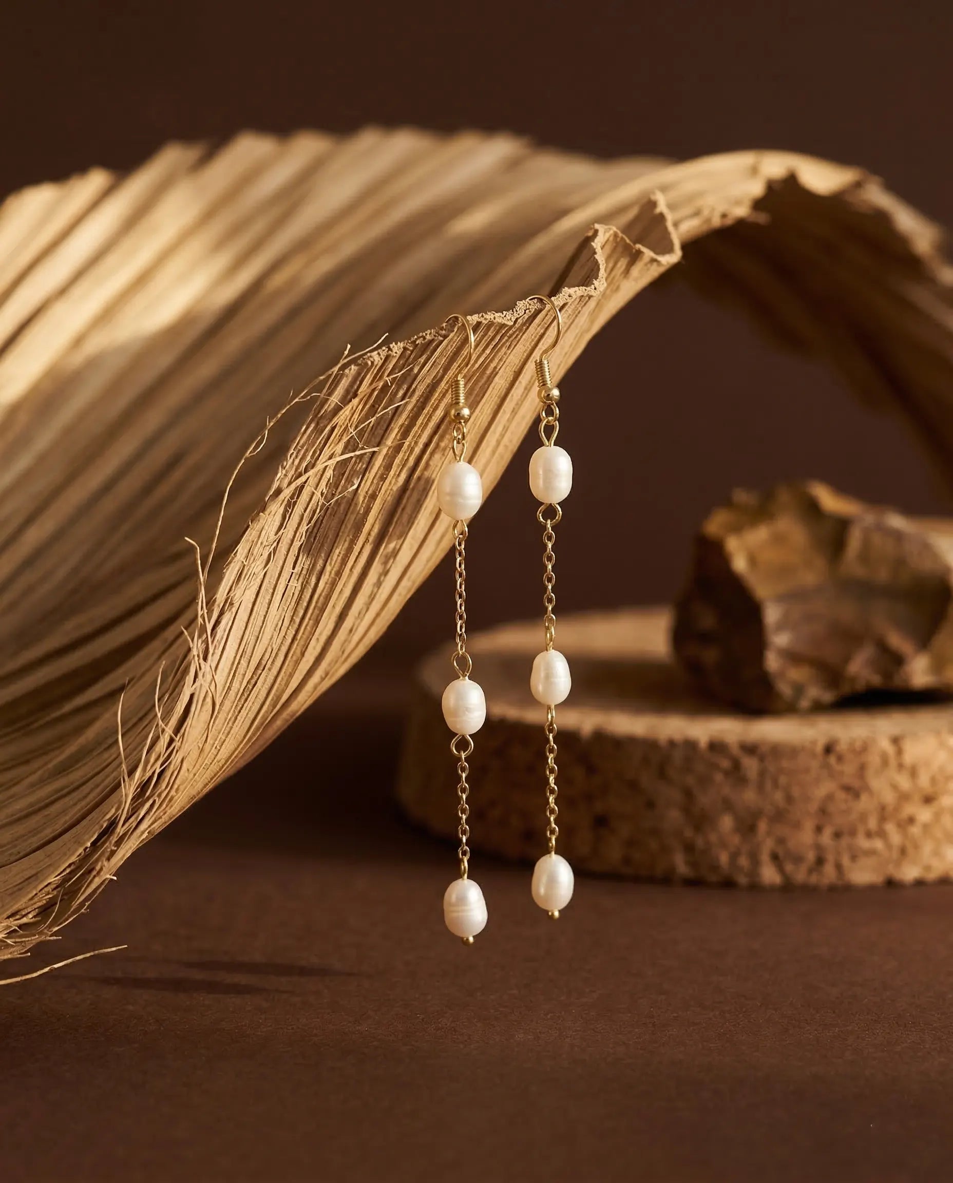 miriam-pearl-earrings-styled-with-natural-elements-minimalist-jewelry-display-for-high-end-boutique-shopping