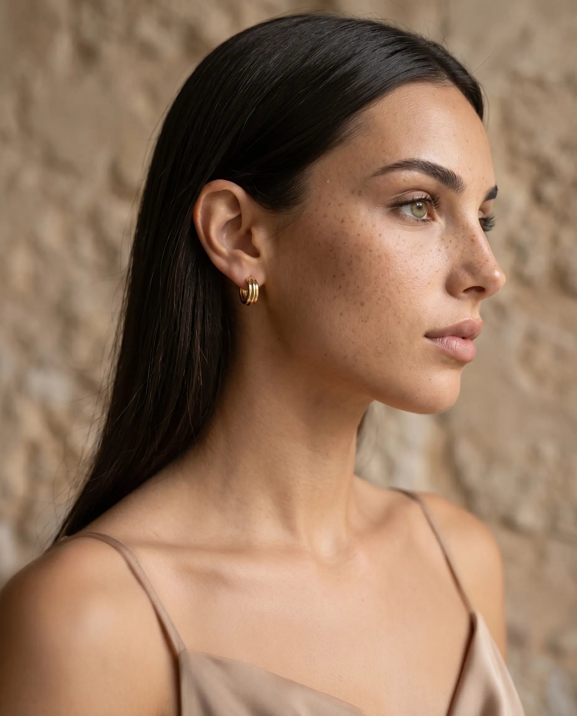 model-profile-wearing-olive-textured-earrings-minimalist-everyday-luxury-jewelry-styling