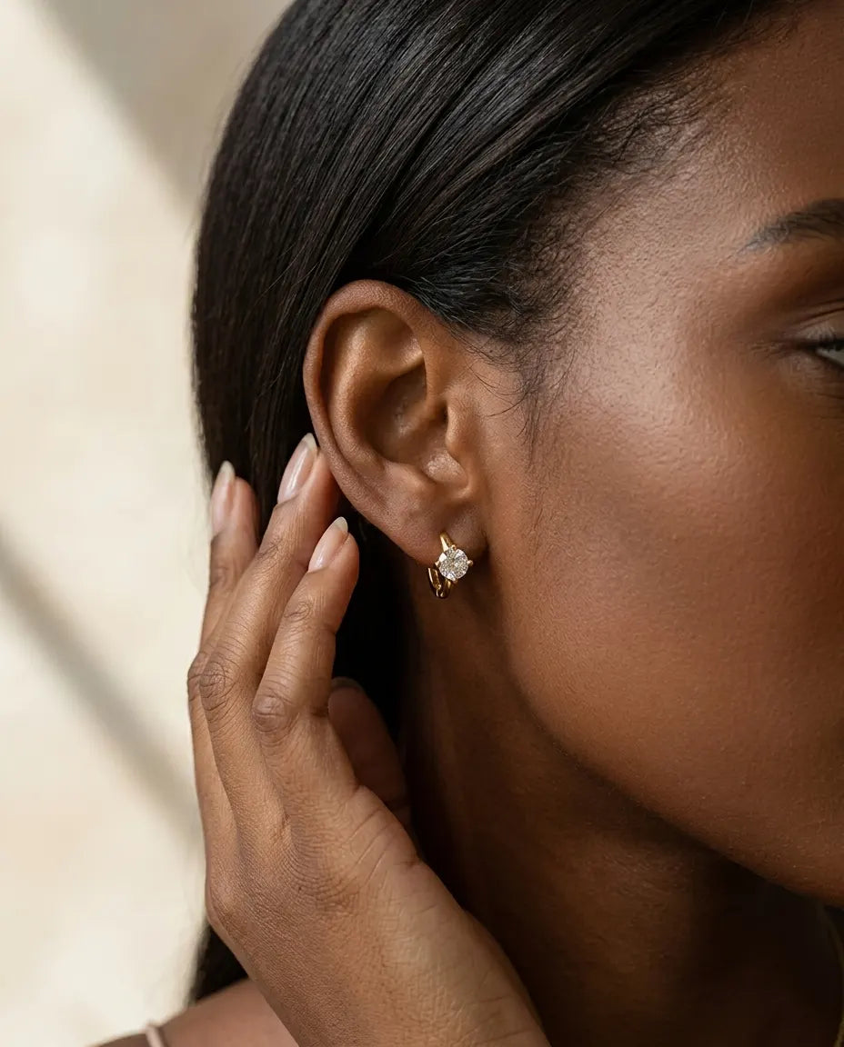 model-wearing-cara-gold-knot-stud-earrings-lifestyle, elegant-modern-feminine-jewelry-on-ear, professional-women-luxury-accessories, chic-small-gold-knot-styling, luxury-lifestyle-brand-model