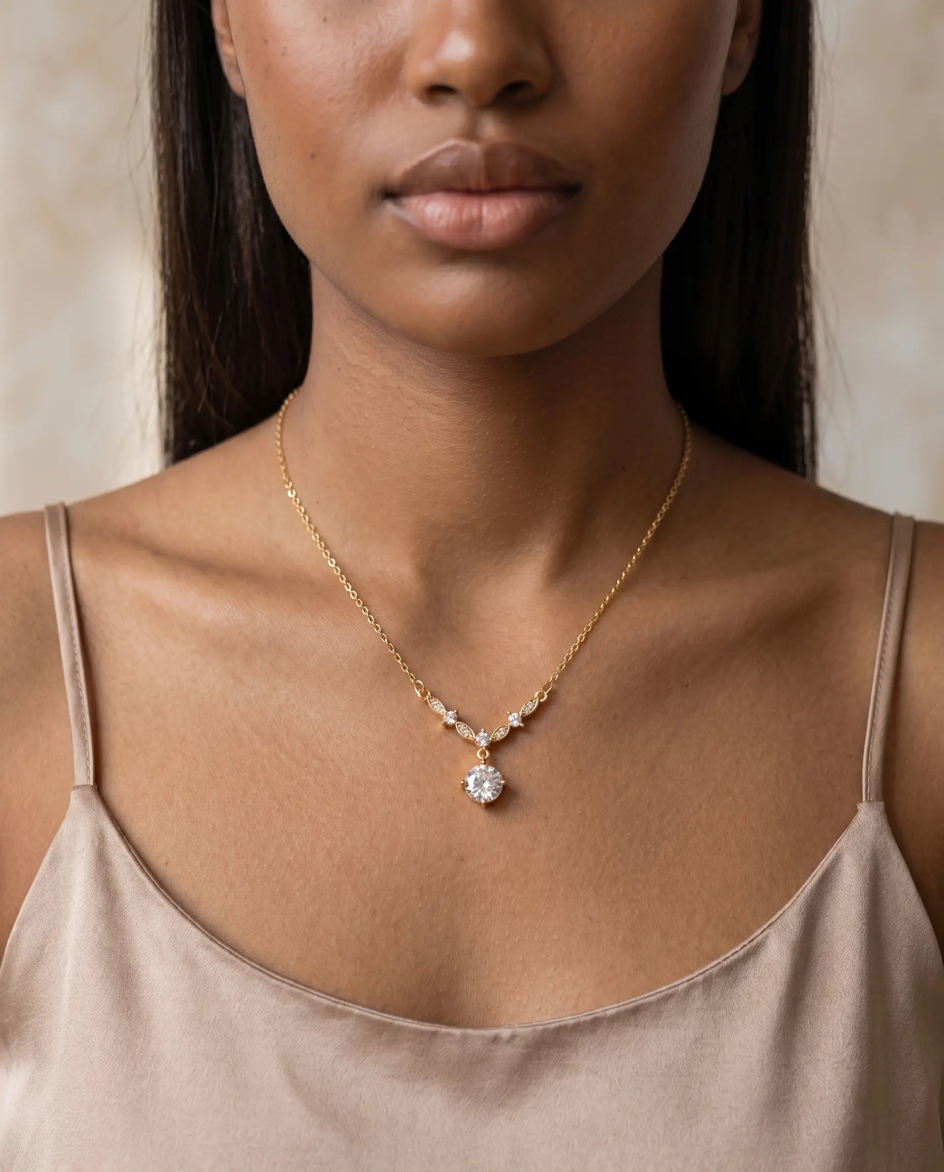 model-wearing-gold-antonietta-drop-necklace, elegant-bold-magnetic-jewelry-lifestyle, professional-women-luxury-accessories, chic-zirconia-lariat-styling, luxury-lifestyle-brand-model
