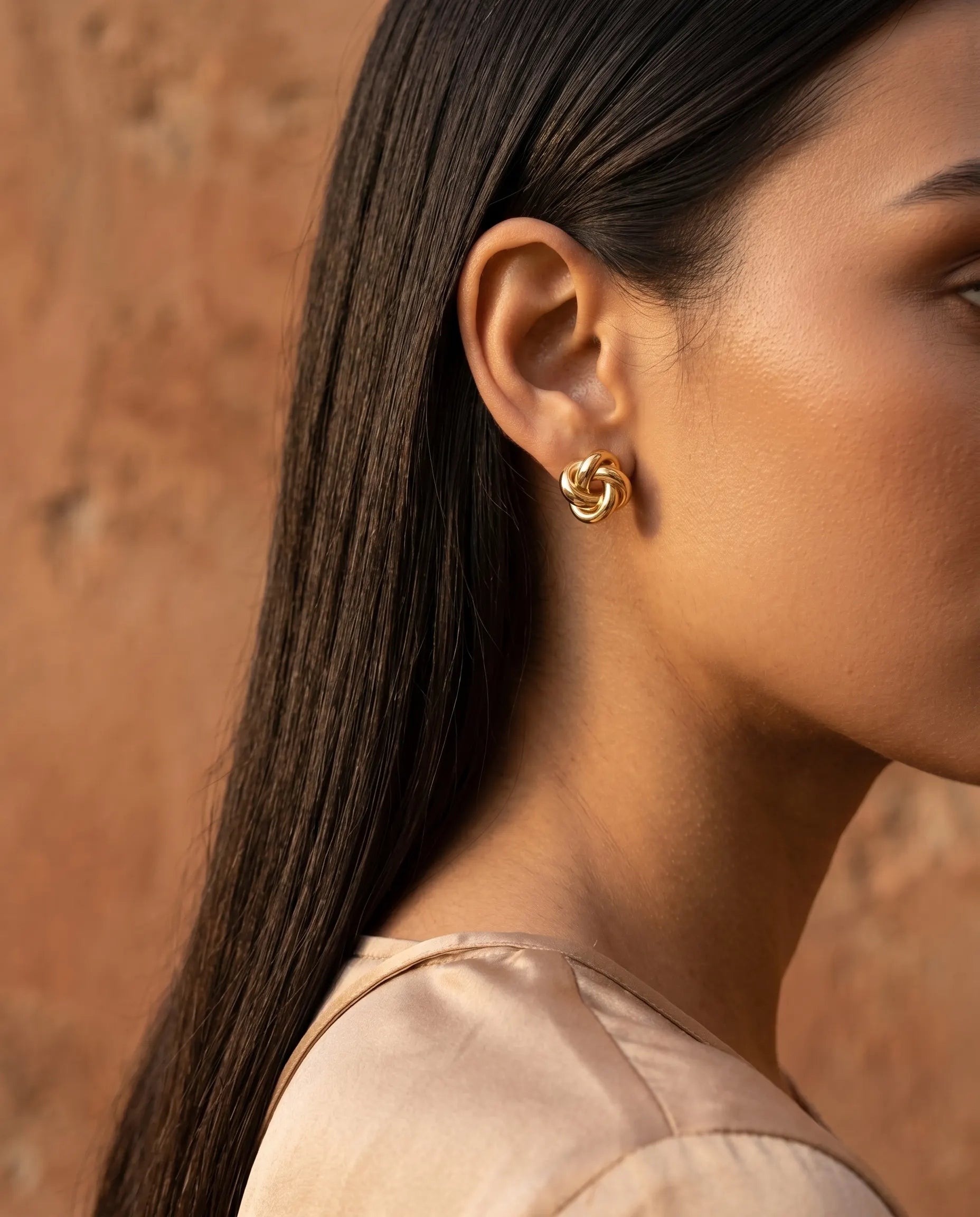 model-wearing-gold-barcelona-link-earrings-lifestyle, elegant-modern-feminine-jewelry-on-ear, professional-women-luxury-accessories, chic-geometric-link-styling, luxury-lifestyle-brand-model
