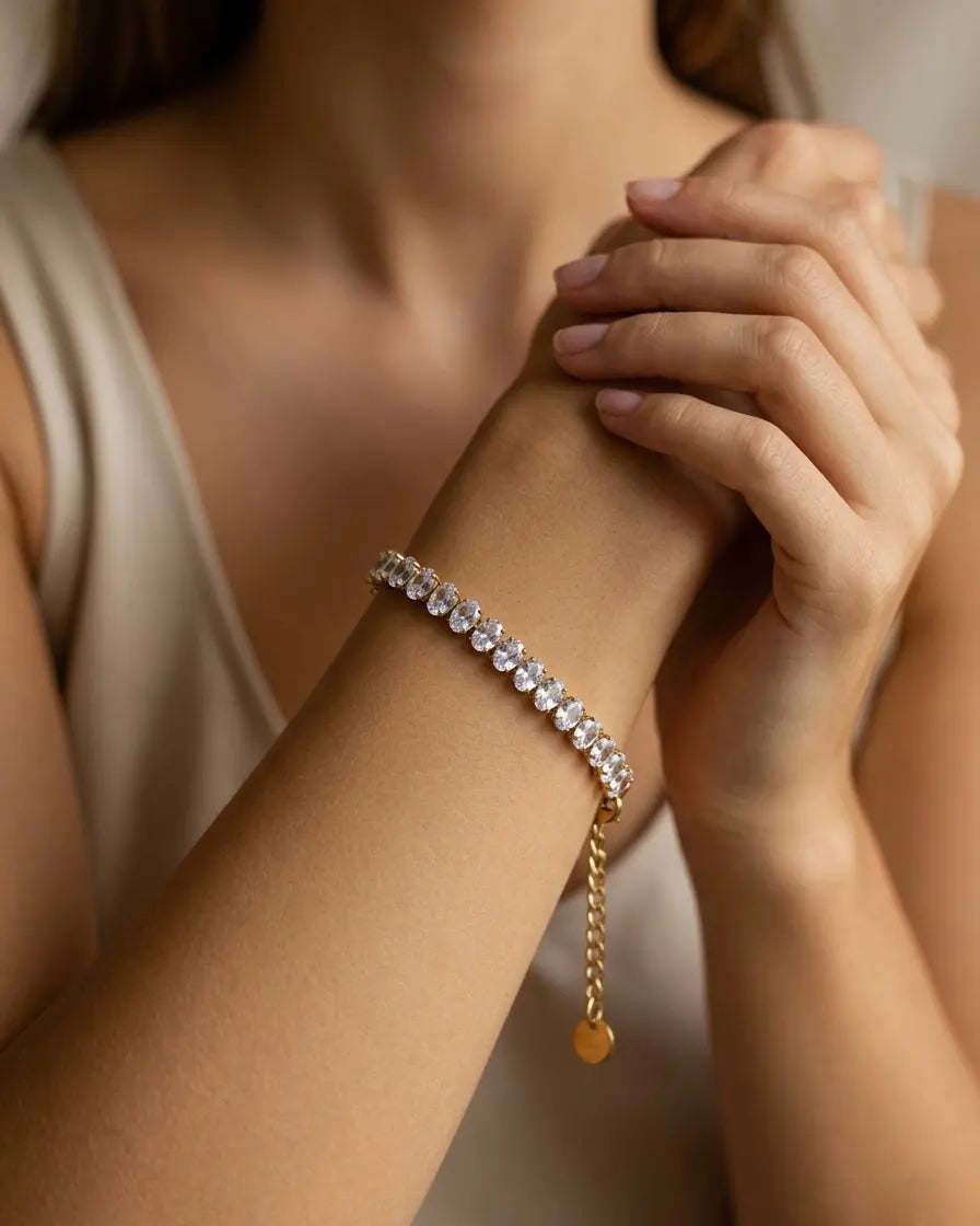 model-wearing-gold-breena-tennis-bracelet-lifestyle, elegant-modern-feminine-jewelry-on-wrist, professional-women-luxury-accessories, chic-gold-crystal-bracelet-styling, luxury-lifestyle-brand-model