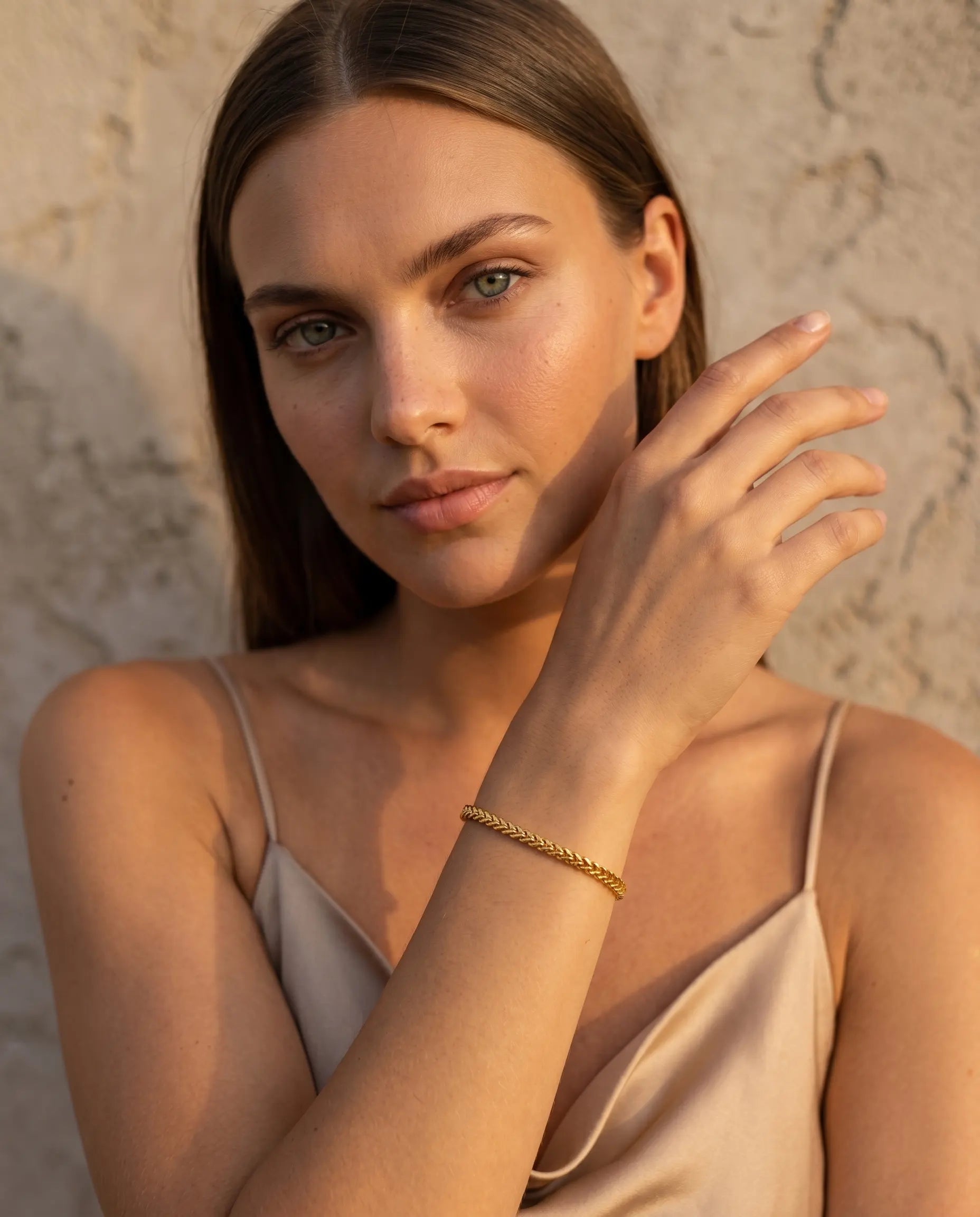 model-wearing-gold-cordira-twisted-bracelet, elegant-effortless-style-jewelry-lifestyle, professional-women-luxury-accessories, chic-minimalist-bracelet-stack-photography, luxury-lifestyle-brand-model