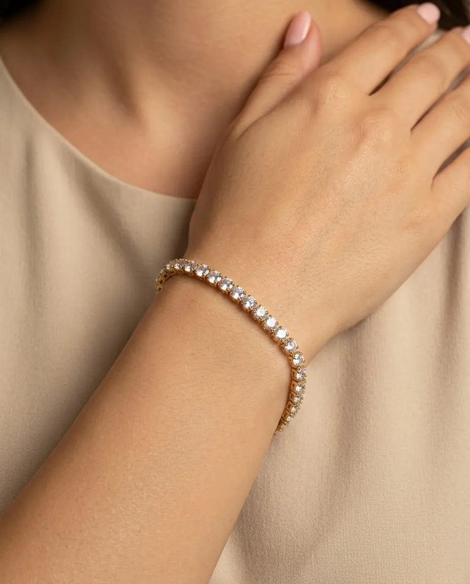 model-wearing-gold-elena-tennis-bracelet-lifestyle, elegant-modern-feminine-jewelry-on-wrist, professional-women-luxury-accessories, chic-gold-crystal-styling, luxury-lifestyle-brand-model