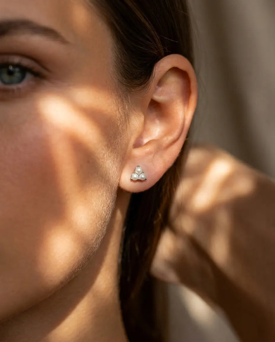 model-wearing-gold-elite-baroque-pearl-earrings-lifestyle, elegant-modern-feminine-jewelry-on-ear, professional-women-luxury-accessories, chic-chunky-pearl-gold-styling, luxury-lifestyle-brand-model