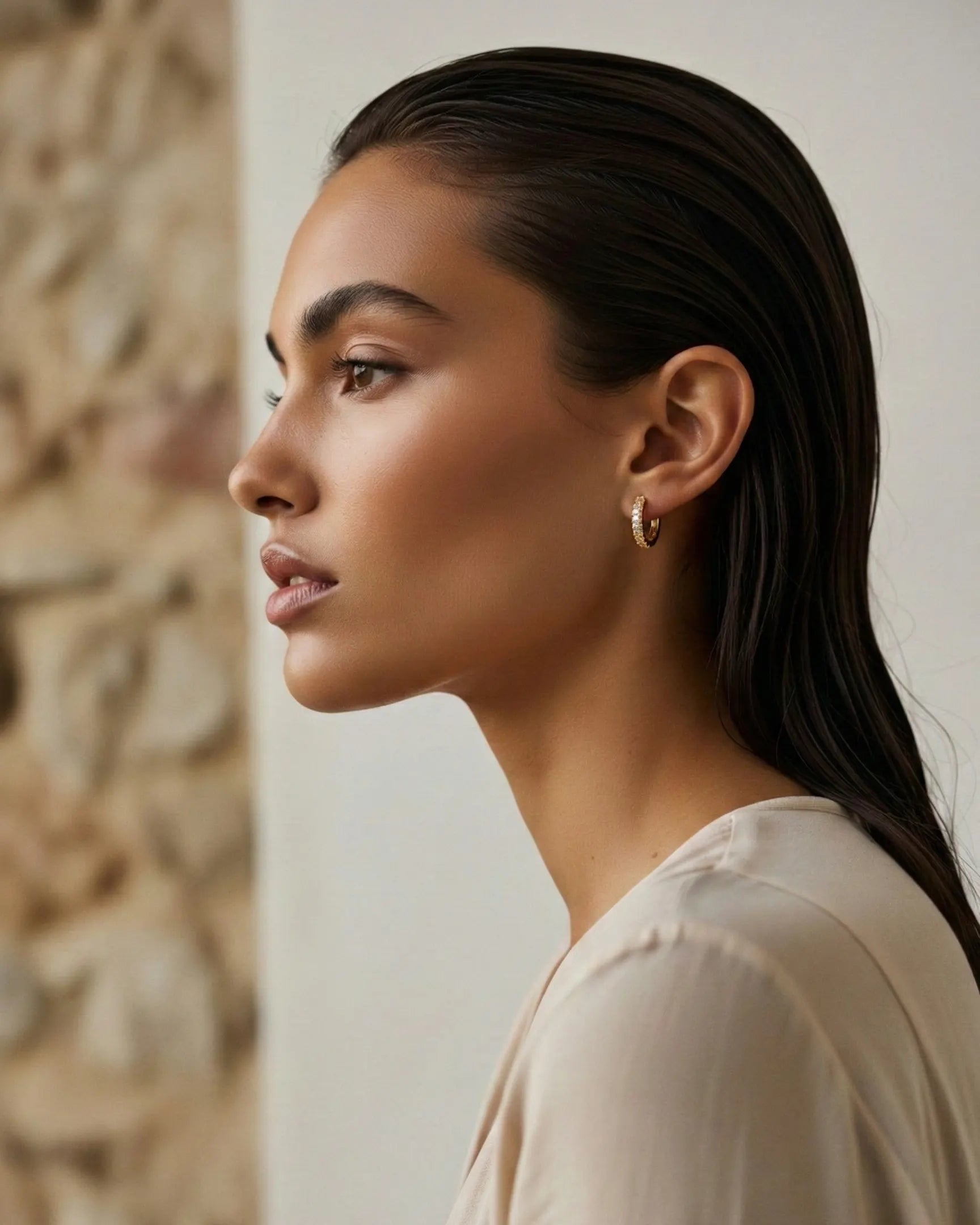 model-wearing-gold-emery-zirconia-hoops, elegant-timeless-jewelry-lifestyle, professional-women-jewelry-style, chic-minimalist-accessories-photography, luxury-lifestyle-brand-model