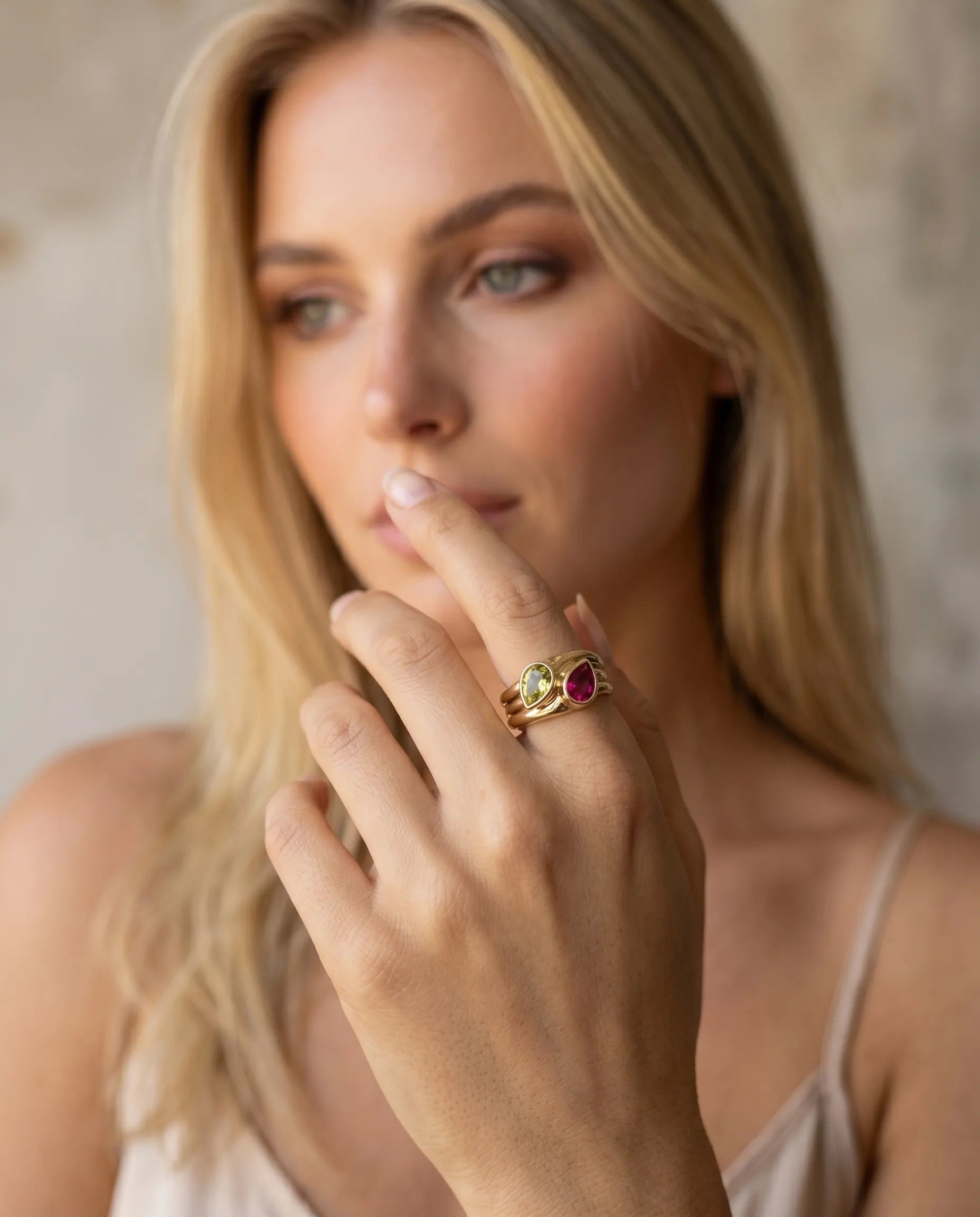 model-wearing-gold-katrina-dual-stone-ring-lifestyle, elegant-bold-feminine-jewelry-on-hand, professional-women-luxury-accessories, chic-gemstone-gold-styling, luxury-lifestyle-brand-model