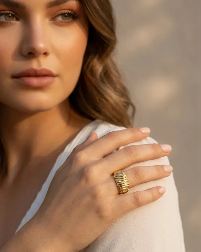 model-wearing-gold-kenza-statement-ring-lifestyle, elegant-modern-power-jewelry-on-hand, professional-women-luxury-accessories, chic-gold-textured-band-styling, luxury-lifestyle-brand-model