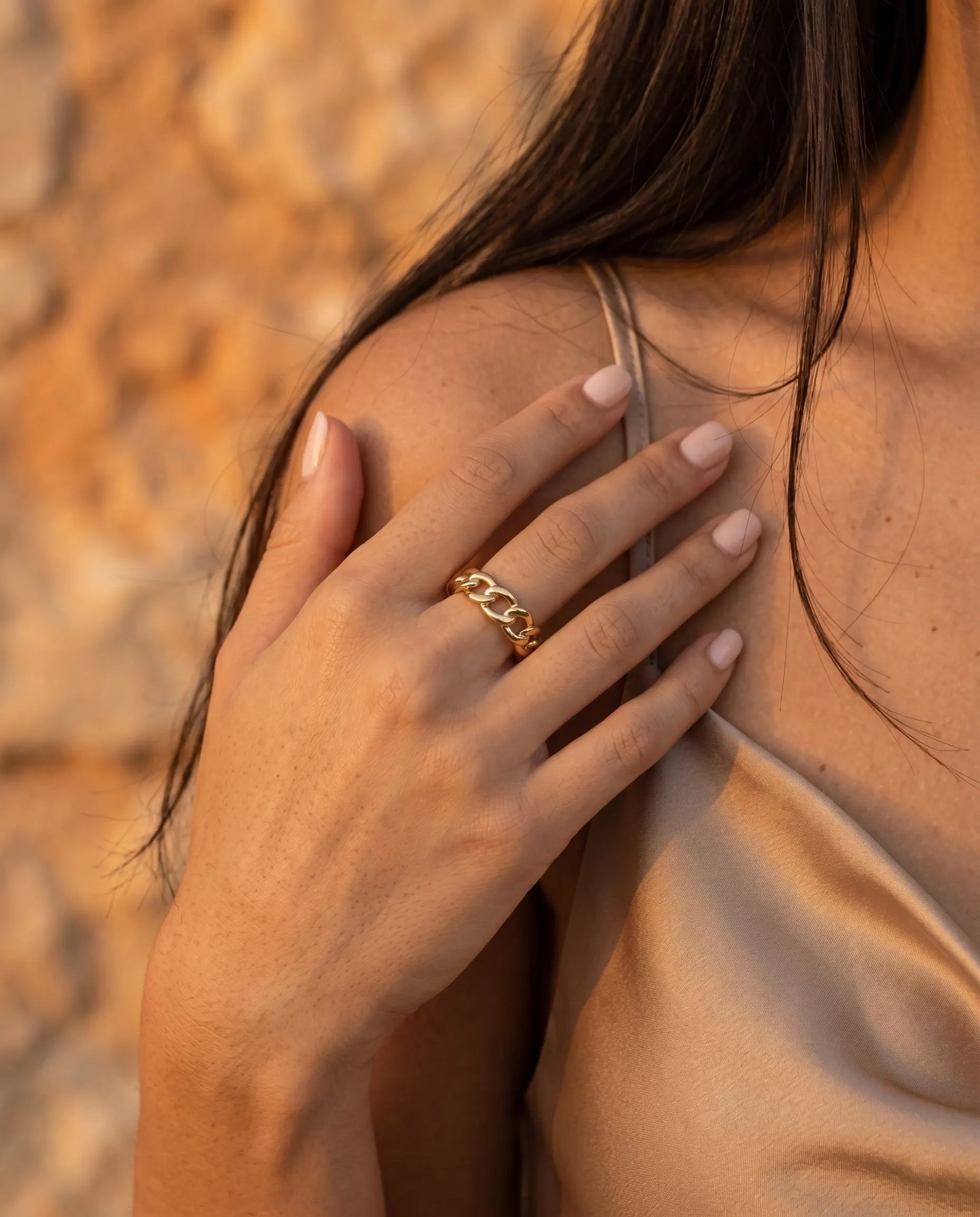 model-wearing-gold-kiana-chain-ring-lifestyle, elegant-modern-understated-jewelry-on-hand, professional-women-luxury-accessories, chic-925-silver-chain-ring-styling, luxury-lifestyle-brand-model