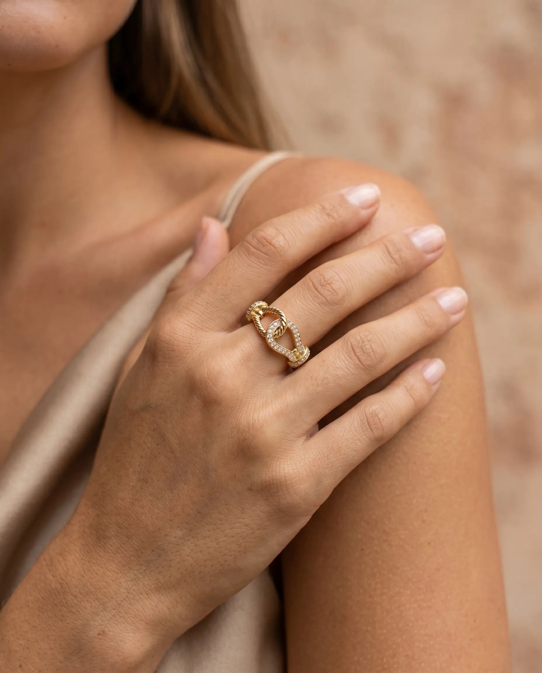 model-wearing-gold-knot-ring-lifestyle-minimalist, elegant-modern-feminine-jewelry-on-hand, professional-women-luxury-accessories, chic-gold-vermeil-styling, luxury-lifestyle-brand-model