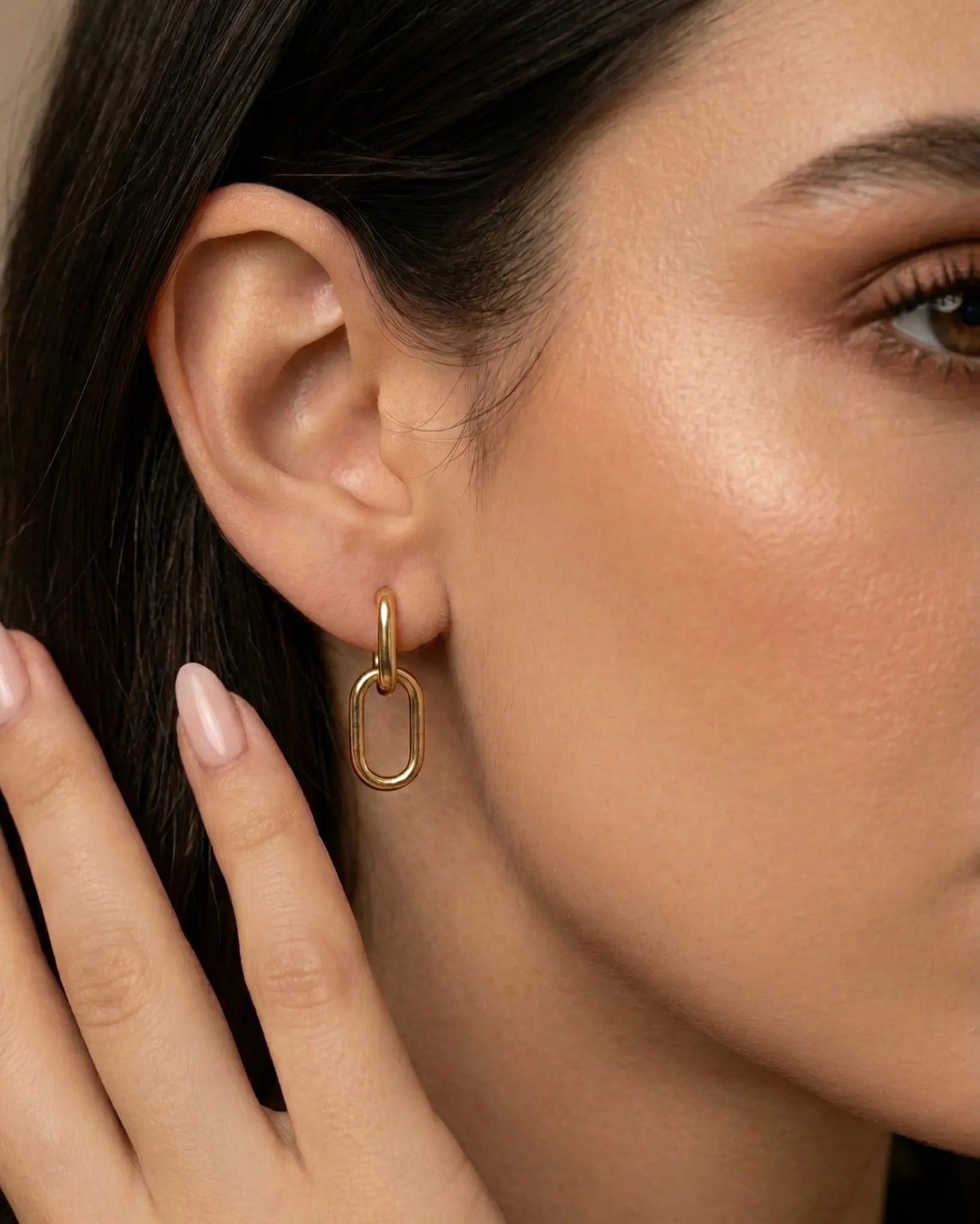 model-wearing-gold-kochi-interlink-earrings-lifestyle, elegant-modern-silhouette-jewelry-on-ear, professional-women-minimalist-accessories, chic-double-link-earring-photography, luxury-lifestyle-brand-model