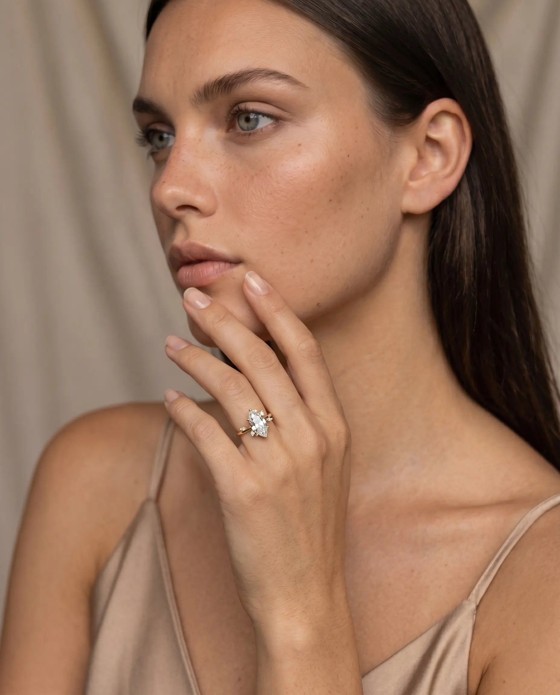 model-wearing-gold-maesta-marquise-ring-lifestyle, elegant-modern-feminine-jewelry-on-hand, professional-women-luxury-accessories, chic-statement-gold-styling, luxury-lifestyle-brand-model