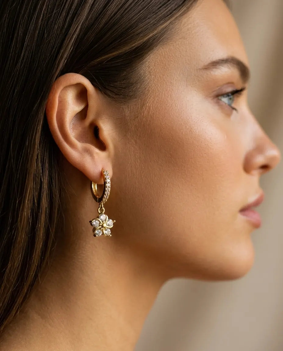 model-wearing-gold-marie-flower-drop-earrings-lifestyle, elegant-modern-feminine-jewelry-on-ear, professional-women-luxury-accessories, chic-floral-gold-styling, luxury-lifestyle-brand-model