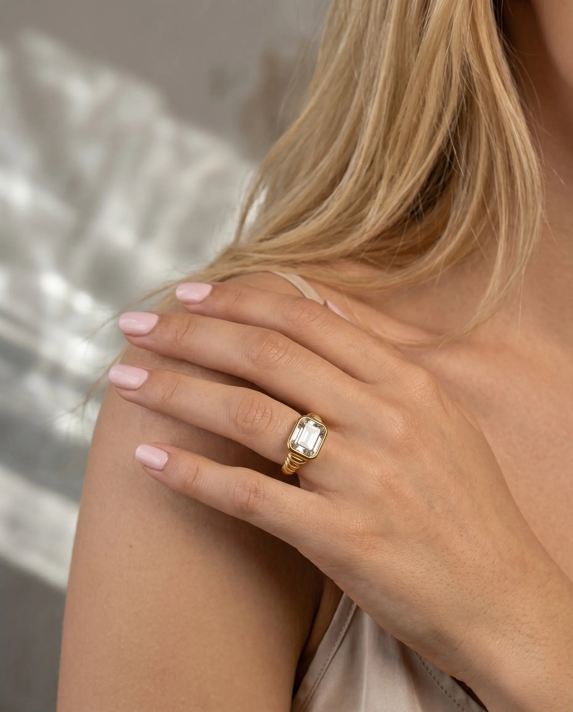 model-wearing-gold-nala-band-ring-lifestyle, elegant-understated-everyday-luxury-jewelry, professional-women-minimalist-accessories, chic-gold-band-ring-photography, luxury-lifestyle-brand-model