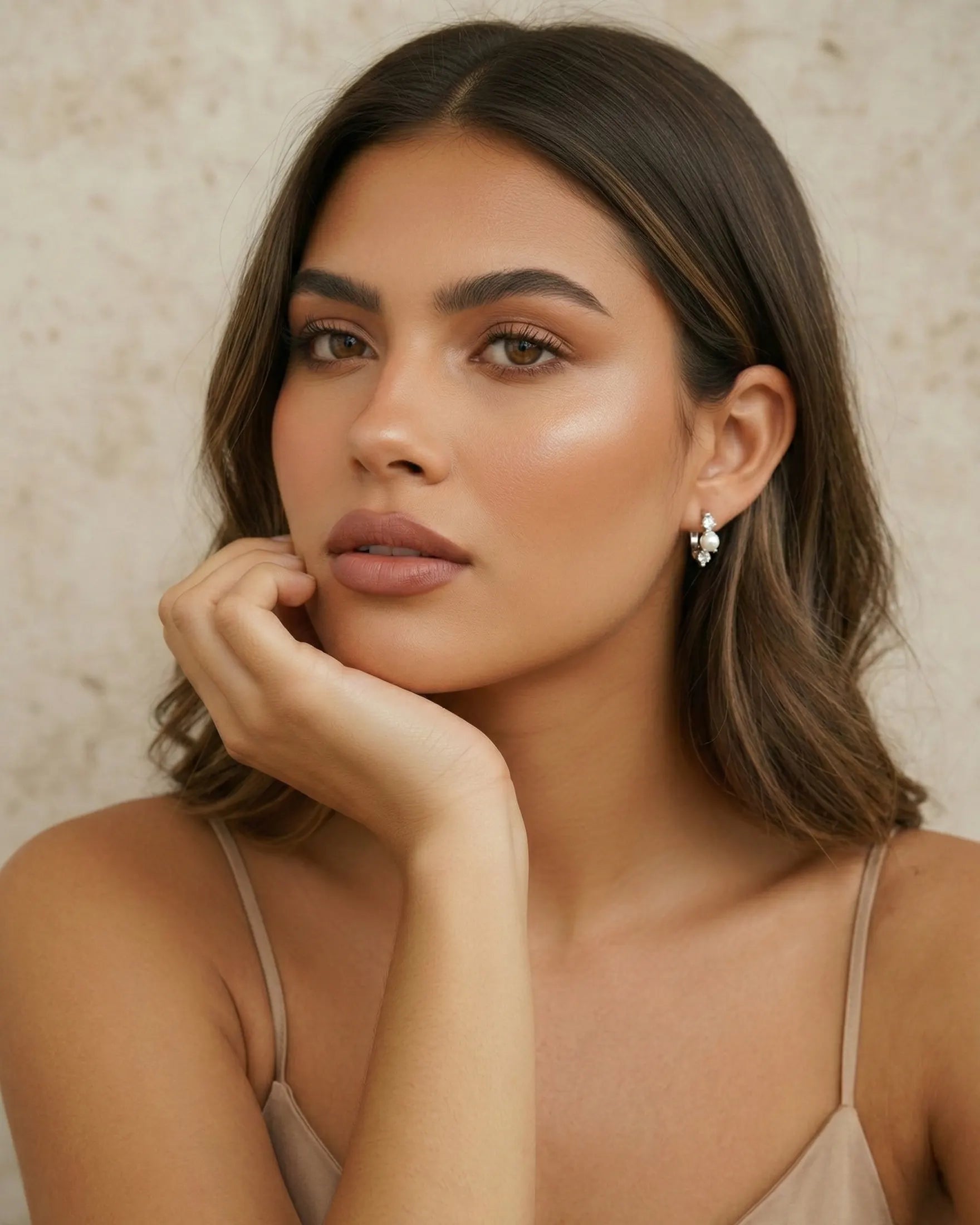 model-wearing-gold-nana-pearl-zirconia-hoops, elegant-timeless-pearl-jewelry-lifestyle, professional-women-wedding-style, chic-minimalist-accessories-photography, luxury-lifestyle-brand-model