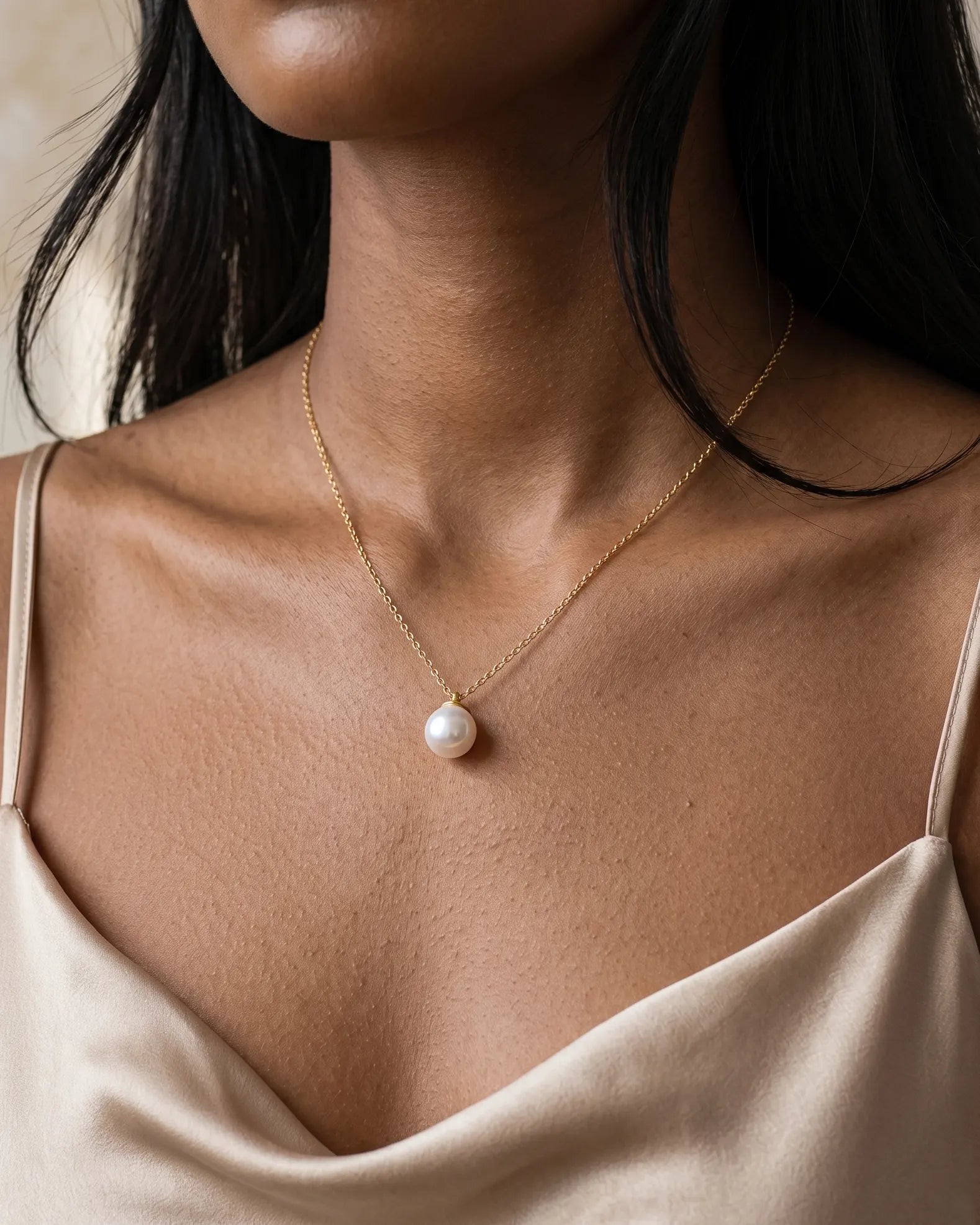 model-wearing-gold-noble-pearl-necklace-lifestyle, elegant-modern-feminine-jewelry-on-neck, professional-women-luxury-accessories, chic-classic-pearl-pendant-styling, luxury-lifestyle-brand-model