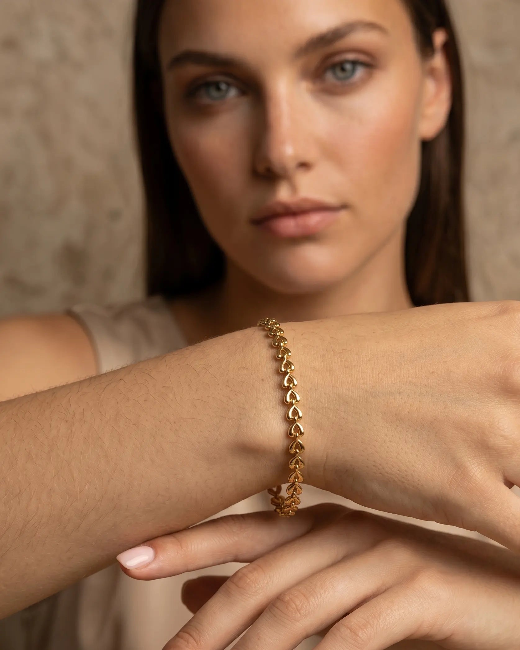 model-wearing-gold-odessa-link-bracelet-lifestyle, elegant-modern-feminine-jewelry-on-wrist, professional-women-luxury-accessories, chic-gold-chain-bracelet-styling, luxury-lifestyle-brand-model
