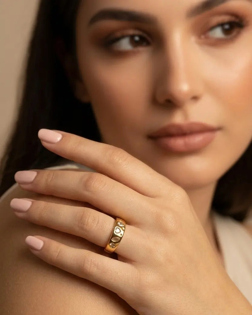 model-wearing-gold-paloma-heart-ring-lifestyle, elegant-modern-romantic-jewelry-on-hand, professional-women-luxury-accessories, chic-adjustable-gold-ring-styling, luxury-lifestyle-brand-model