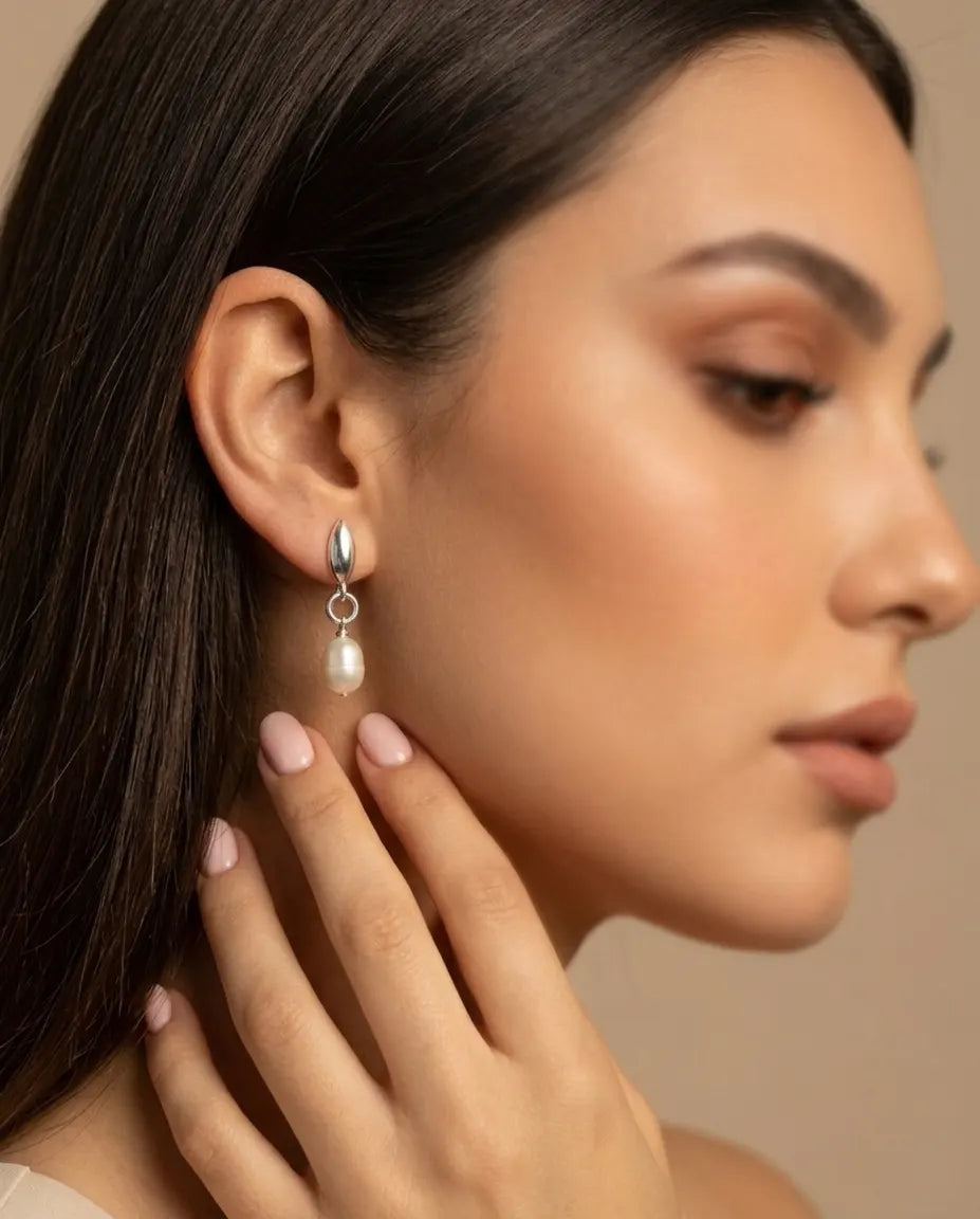 model-wearing-gold-petal-pearl-drop-earrings-lifestyle, elegant-modern-feminine-jewelry-on-ear, professional-women-luxury-accessories, chic-botanical-gold-styling, luxury-lifestyle-brand-model