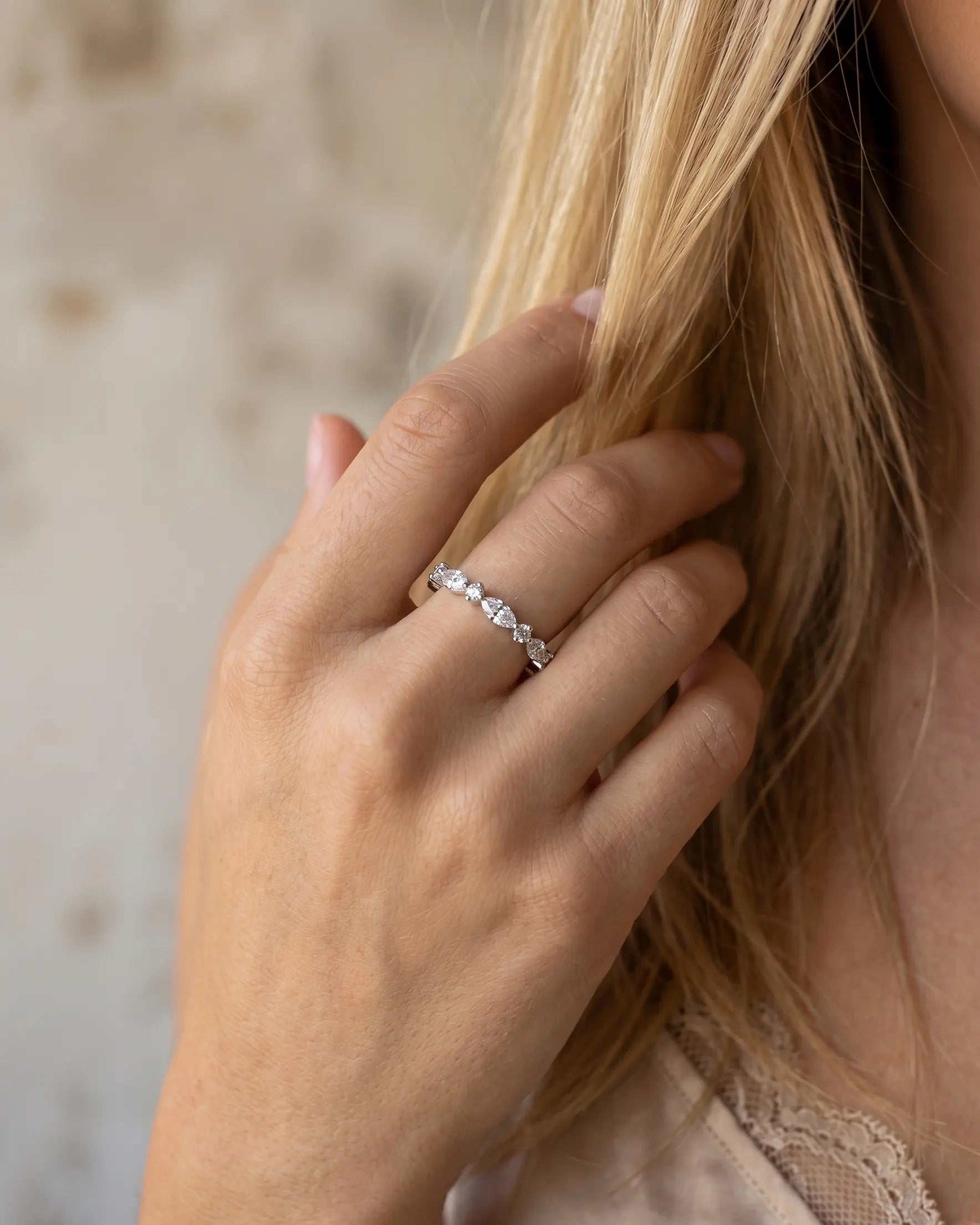 model-wearing-gold-prism-stacking-ring-lifestyle, elegant-modern-feminine-jewelry-on-hand, professional-women-luxury-accessories, chic-marquise-gold-styling, luxury-lifestyle-brand-model