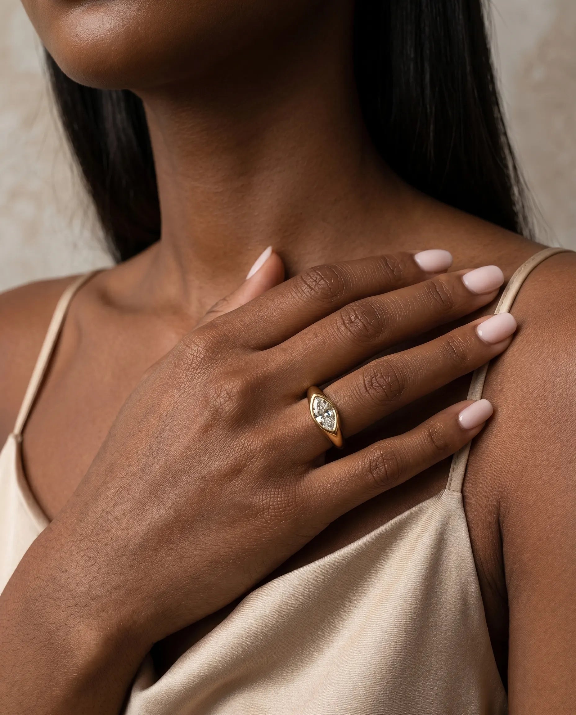 model-wearing-gold-selah-marquise-ring-lifestyle, elegant-bold-radiance-jewelry-on-hand, professional-women-luxury-accessories, chic-marquise-cut-zirconia-ring-photography, luxury-lifestyle-brand-model