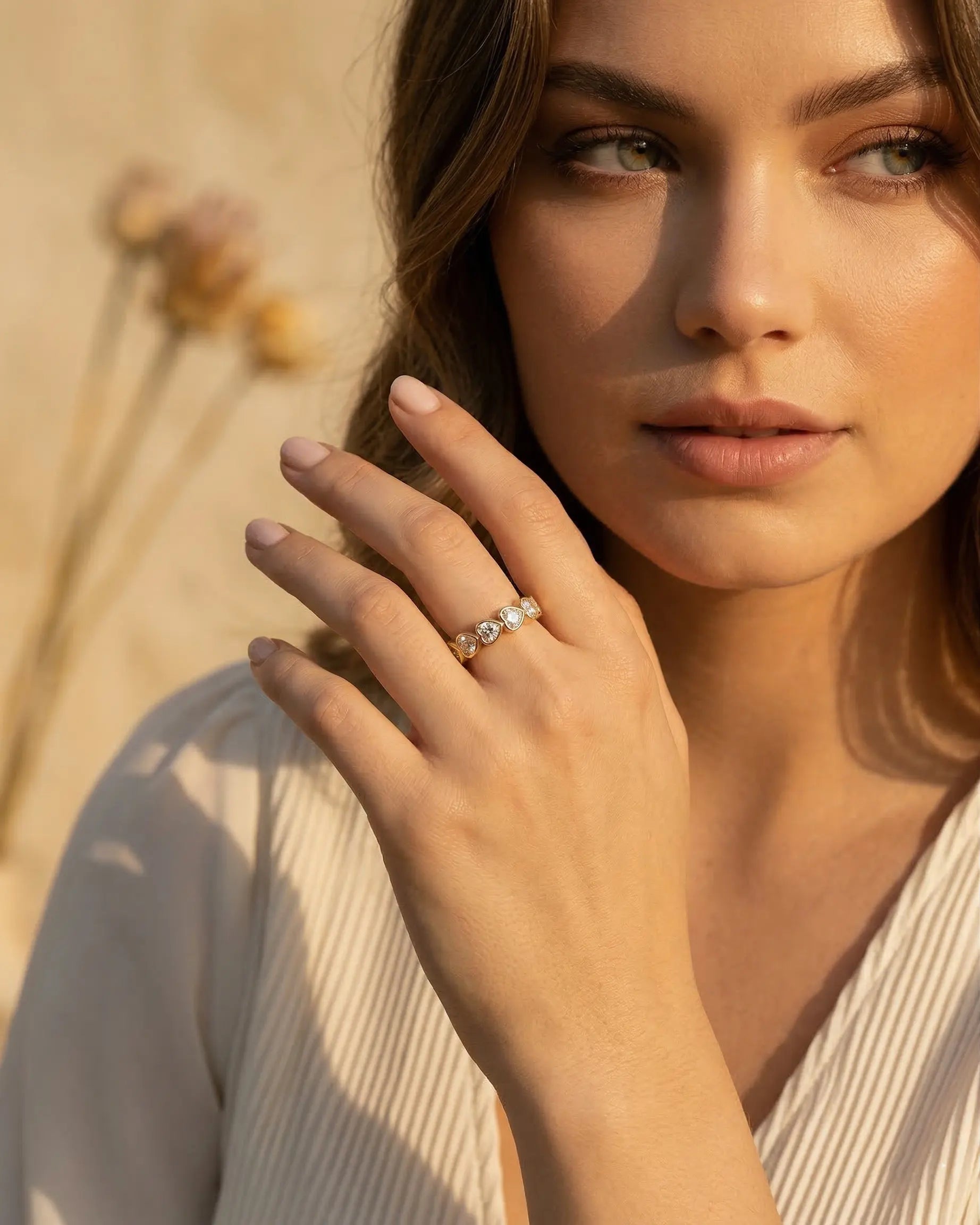 model-wearing-gold-siena-baguette-ring-lifestyle, elegant-modern-feminine-jewelry-on-hand, professional-women-luxury-accessories, chic-baguette-crystal-ring-styling, luxury-lifestyle-brand-model