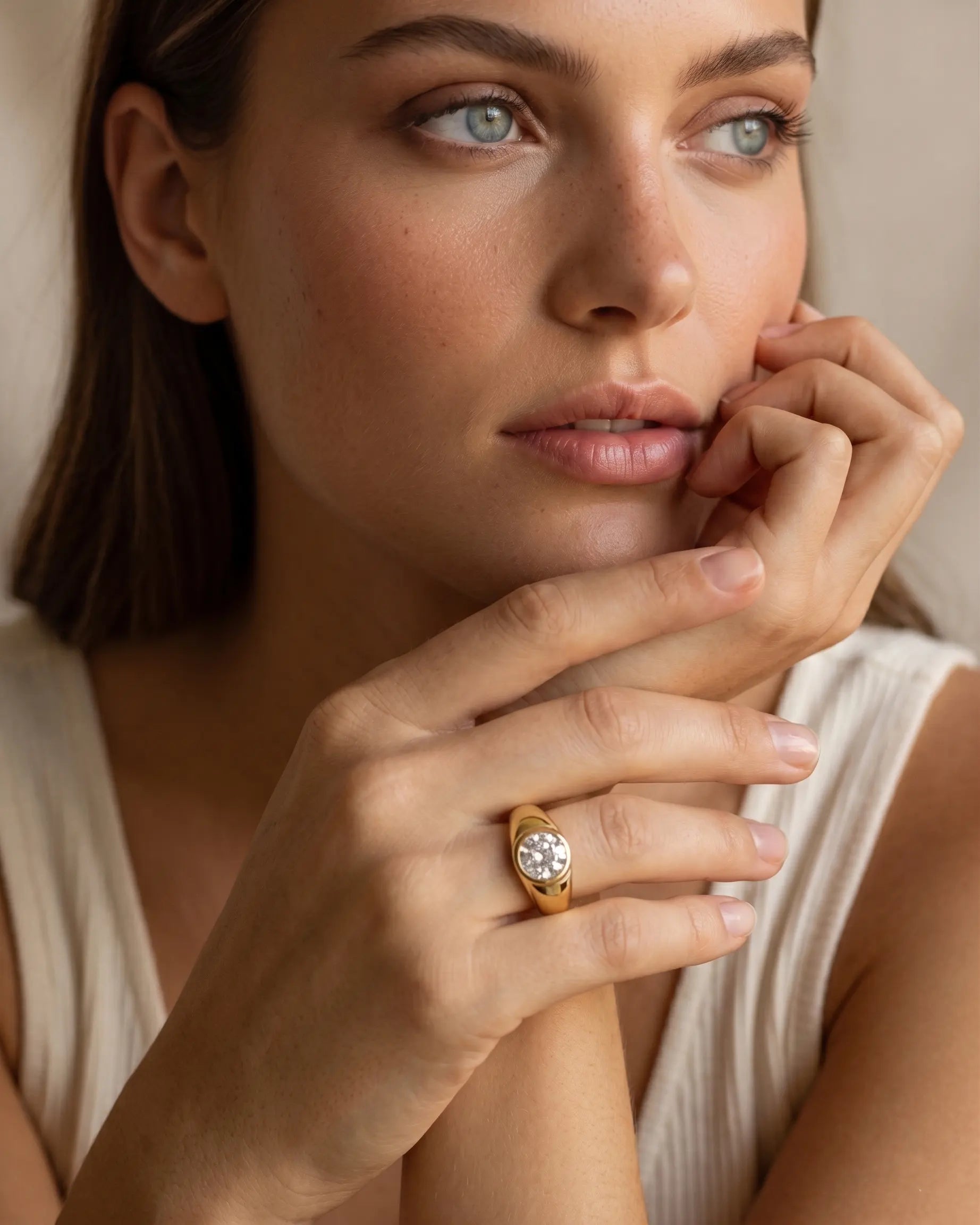model-wearing-gold-span-baguette-ring-lifestyle, elegant-modern-bold-jewelry-on-hand, professional-women-luxury-accessories, chic-emerald-cut-crystal-ring-styling, luxury-lifestyle-brand-model