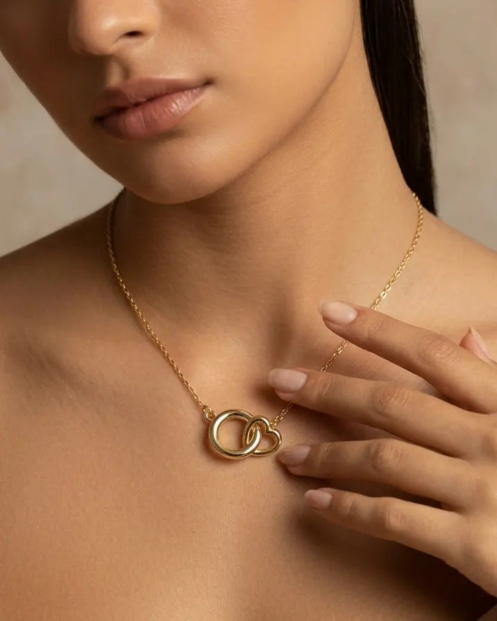 model-wearing-gold-valentina-interlocking-necklace-lifestyle, elegant-modern-feminine-jewelry-on-neck, professional-women-luxury-accessories, chic-double-circle-pendant-styling, luxury-lifestyle-brand-model
