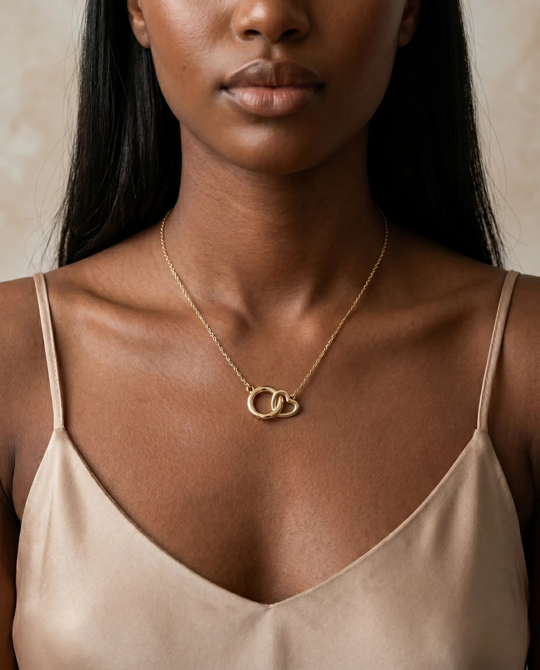 model-wearing-gold-valentina-interlocking-necklace-lifestyle, elegant-modern-feminine-jewelry-on-neck, professional-women-luxury-accessories, chic-double-circle-pendant-styling, luxury-lifestyle-brand-model