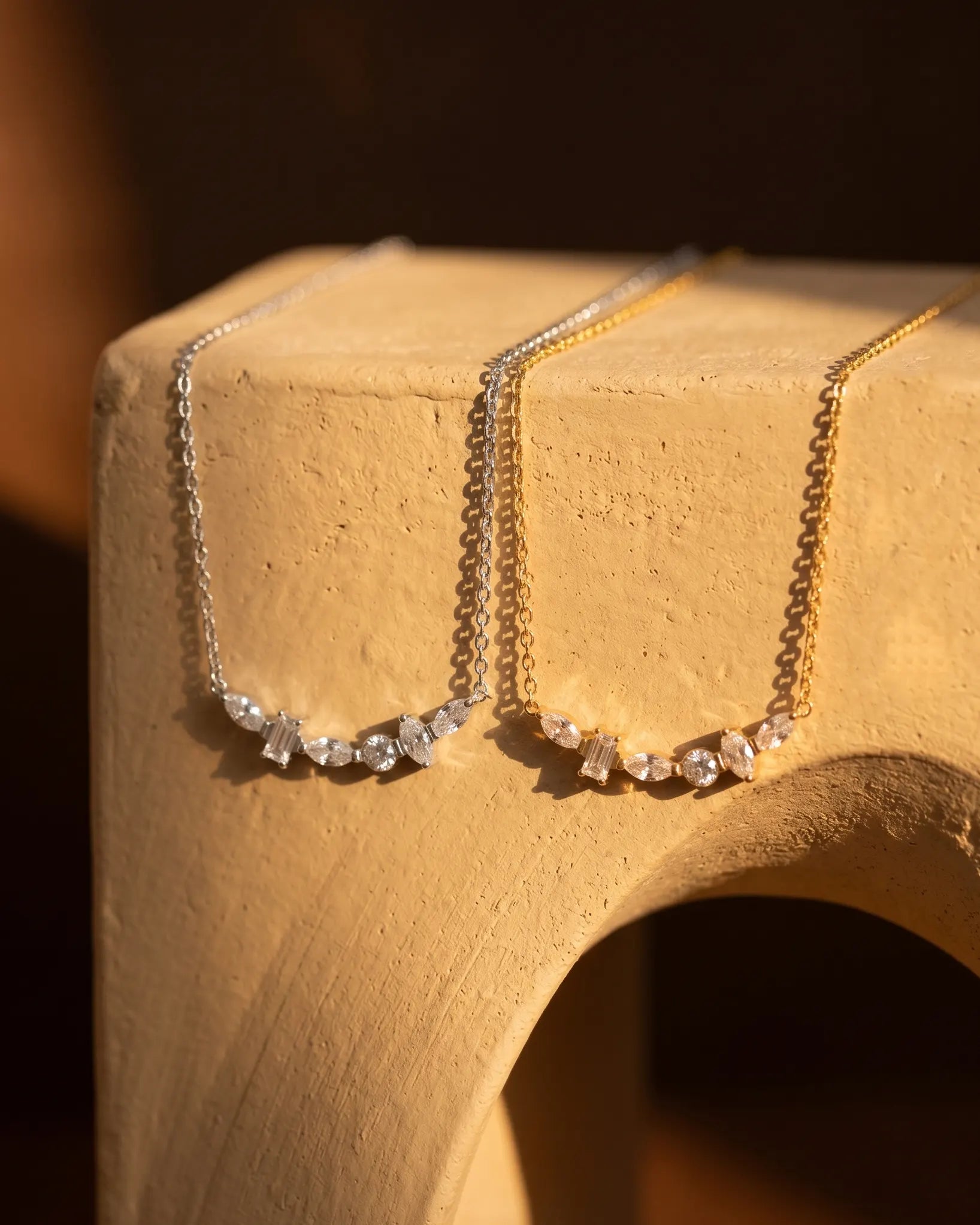 model-wearing-silver-donna-baguette-necklace-lifestyle, elegant-modern-feminine-jewelry-on-neck, professional-women-luxury-accessories, chic-sparkling-statement-necklace-styling, luxury-lifestyle-brand-model