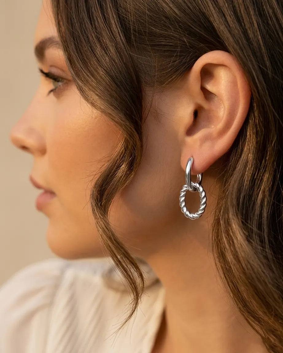 model-wearing-silver-ferrach-twisted-hoops, elegant-understated-cool-girl-jewelry-lifestyle, professional-women-minimalist-accessories, chic-twisted-link-earring-photography, luxury-lifestyle-brand-model