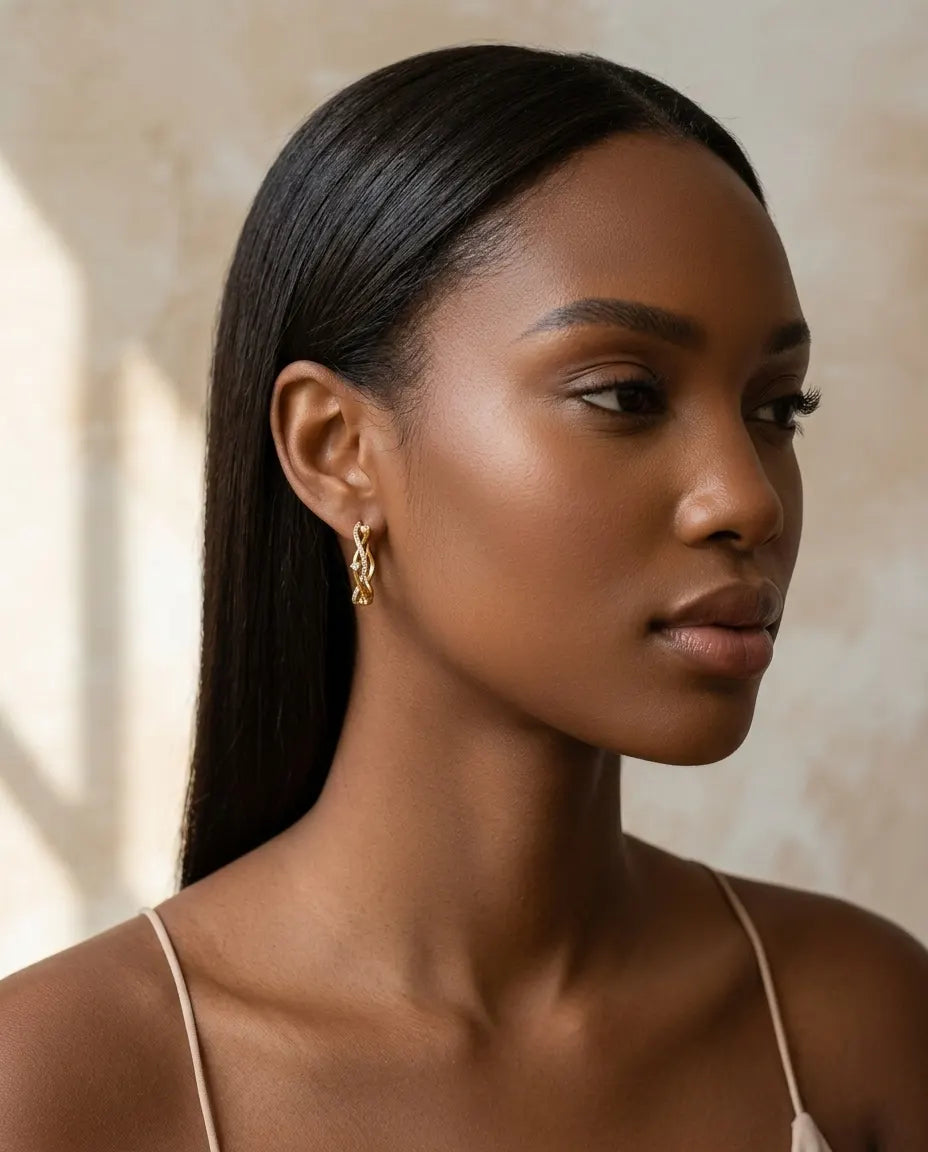 model-wearing-silver-maddie-twisted-pave-hoops-lifestyle, elegant-modern-feminine-jewelry-on-ear, professional-women-luxury-accessories, chic-interlocking-silver-styling, luxury-lifestyle-brand-model