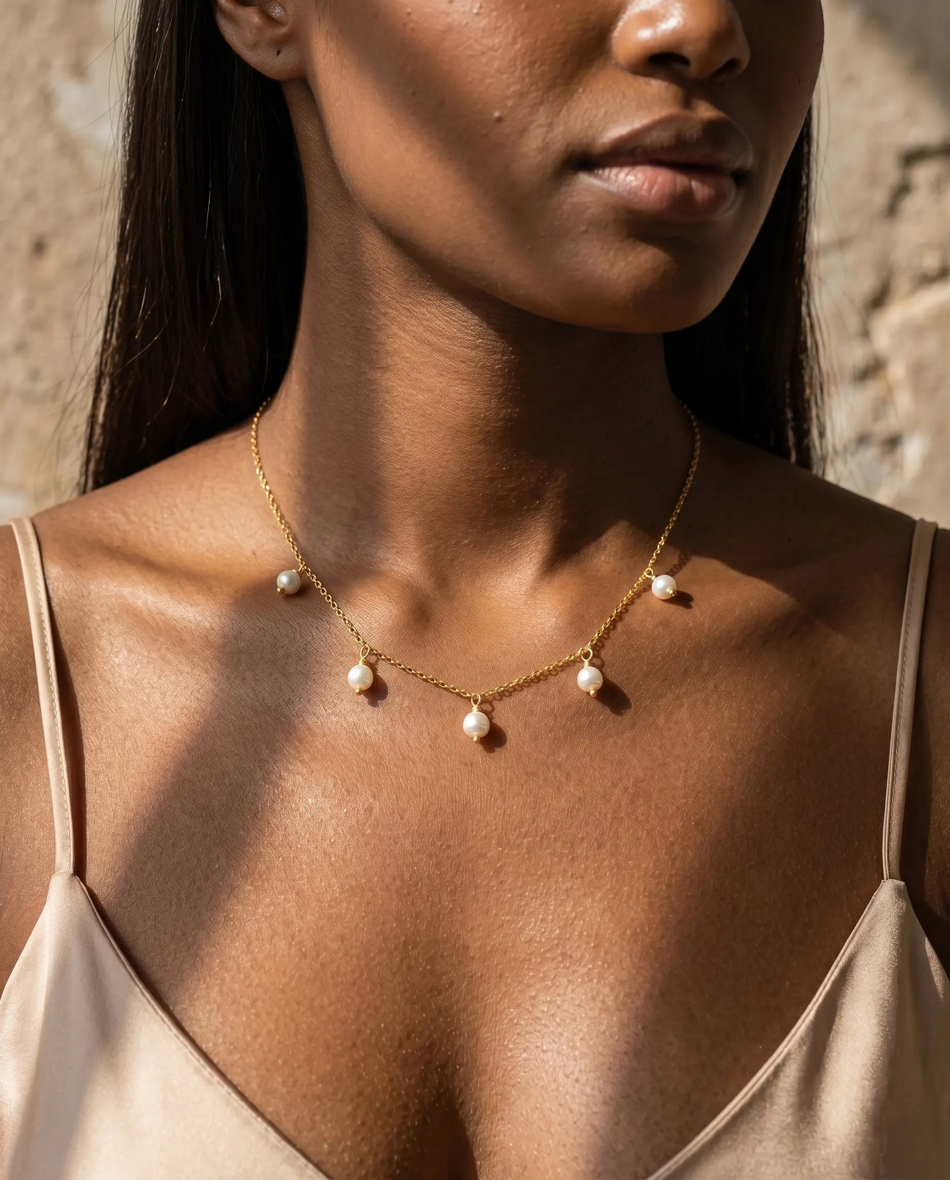 model-wearing-silver-nora-pearl-necklace-lifestyle, elegant-modern-feminine-jewelry-on-neck, professional-women-luxury-accessories, chic-multi-pearl-pendant-styling, luxury-lifestyle-brand-model