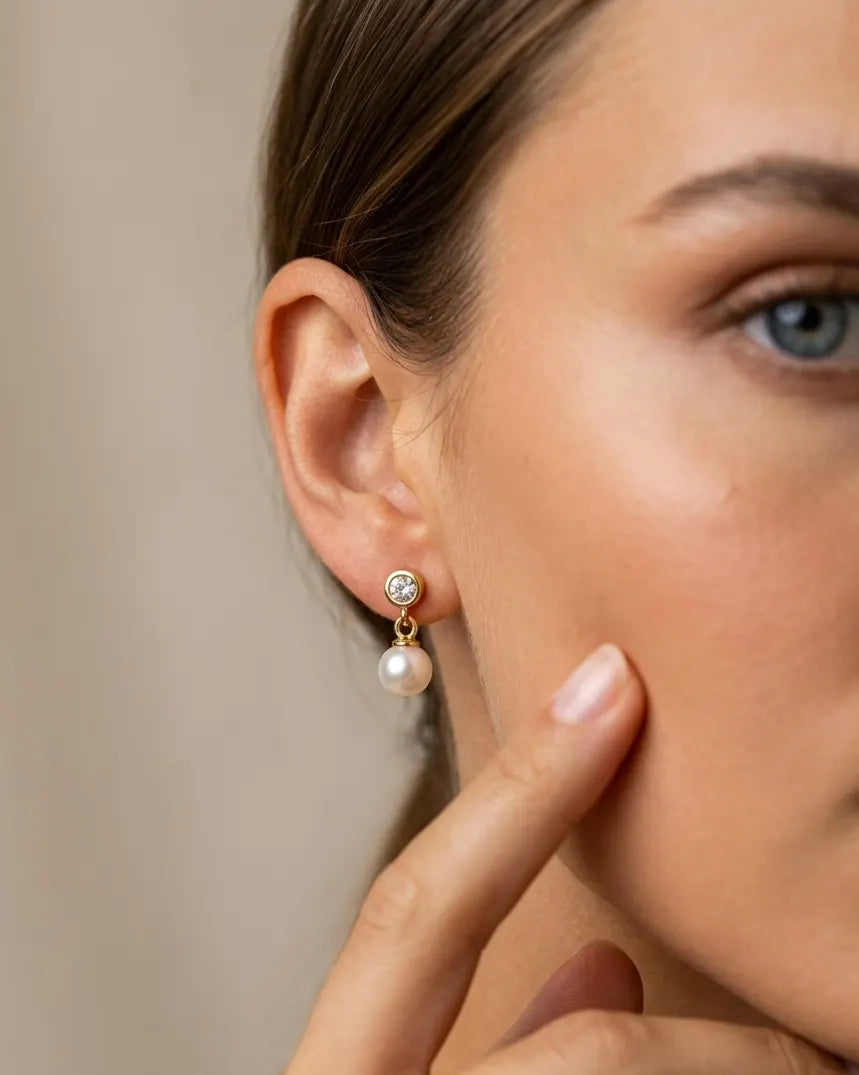 model-wearing-silver-romy-crystal-drop-earrings-lifestyle, elegant-modern-feminine-jewelry-on-ear, professional-women-luxury-accessories, chic-solitaire-silver-styling, luxury-lifestyle-brand-model