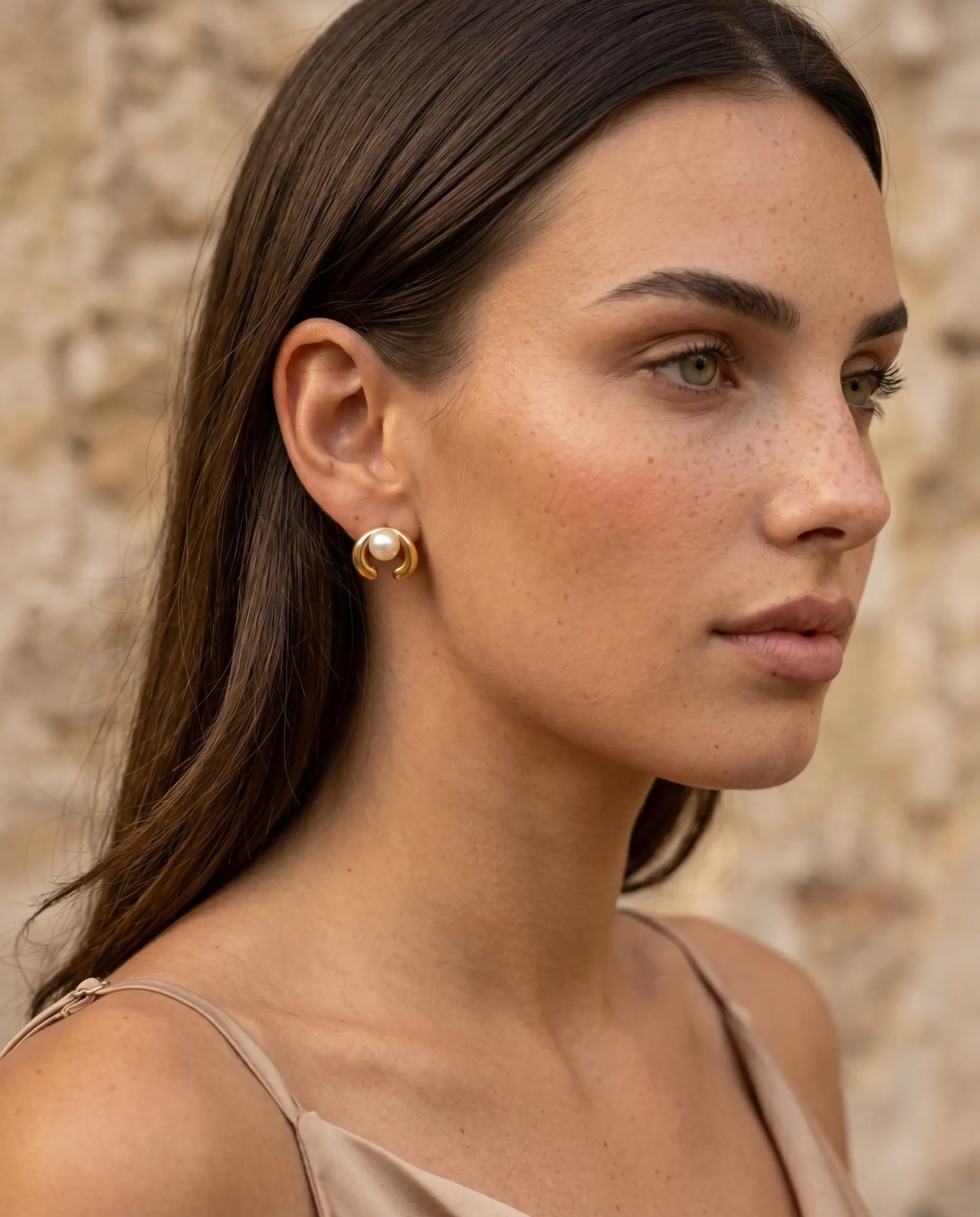 model-wearing-the-celine-pearl-arch-studs-showcasing-sophisticated-minimalist-ear-styling-for-modern-women