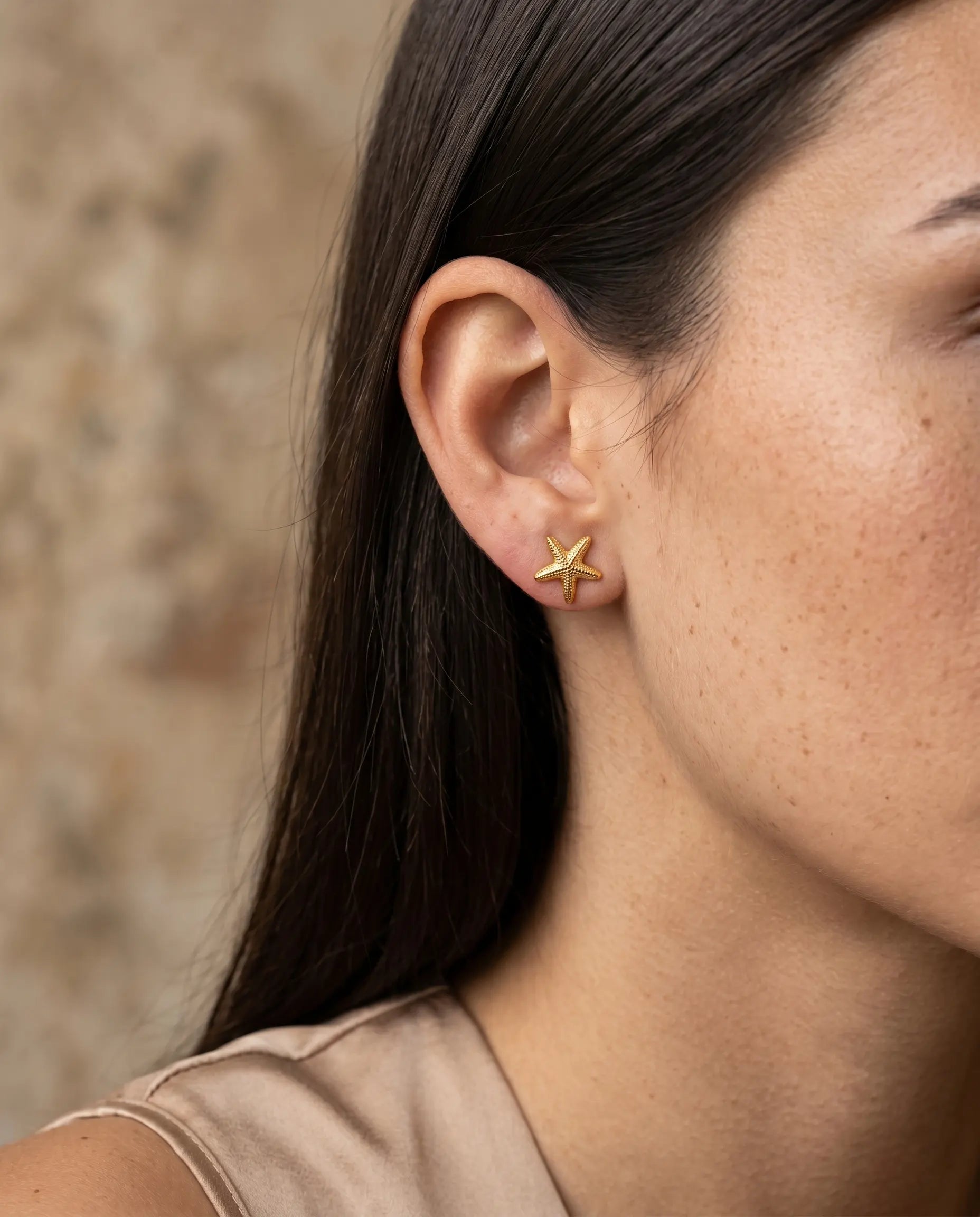 model-wearing-the-marisol-starfish-studs-showcasing-delicate-coastal-design-and-perfect-fit-minimalist-styling