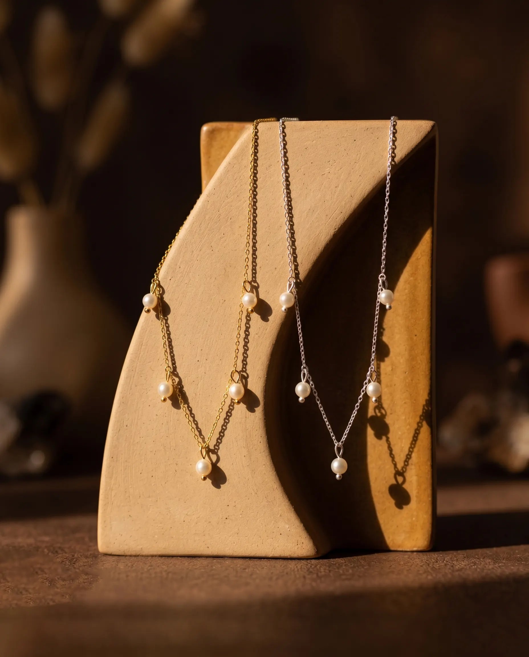 premium-quality-nora-pearl-drop-gold-silver-necklaces, durable-gold-plating-detail-europe, anniversary-gift-modern-pearl-pendant, refined-minimalist-luxe-aesthetic, sustainable-jewelry-brand-europe
