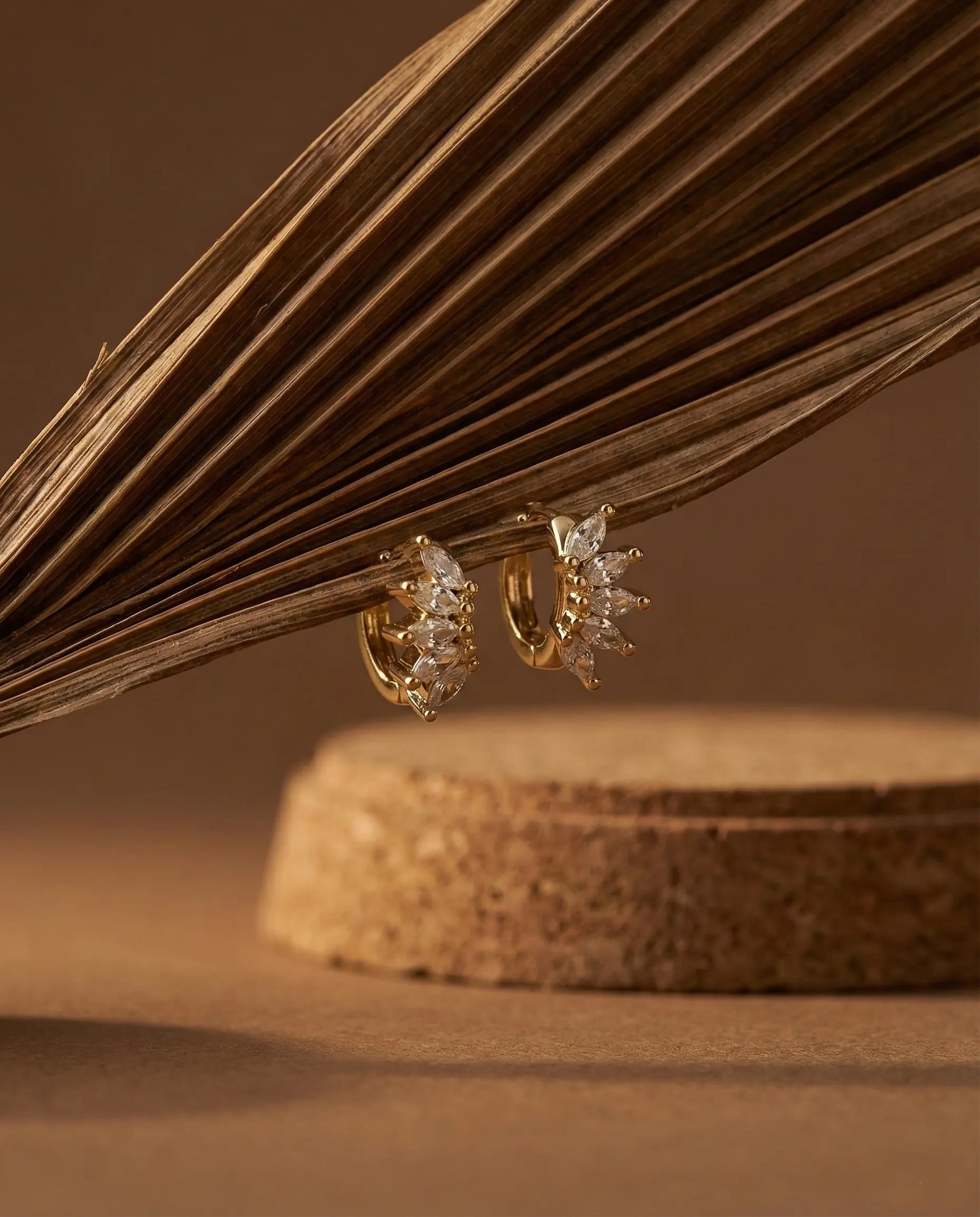 premium-quality-star-huggie-hoop-earrings, durable-gold-plating-detail-europe, anniversary-gift-gold-starburst-earrings, refined-minimalist-jewelry-aesthetic, sustainable-silver-jewelry-brand-europe