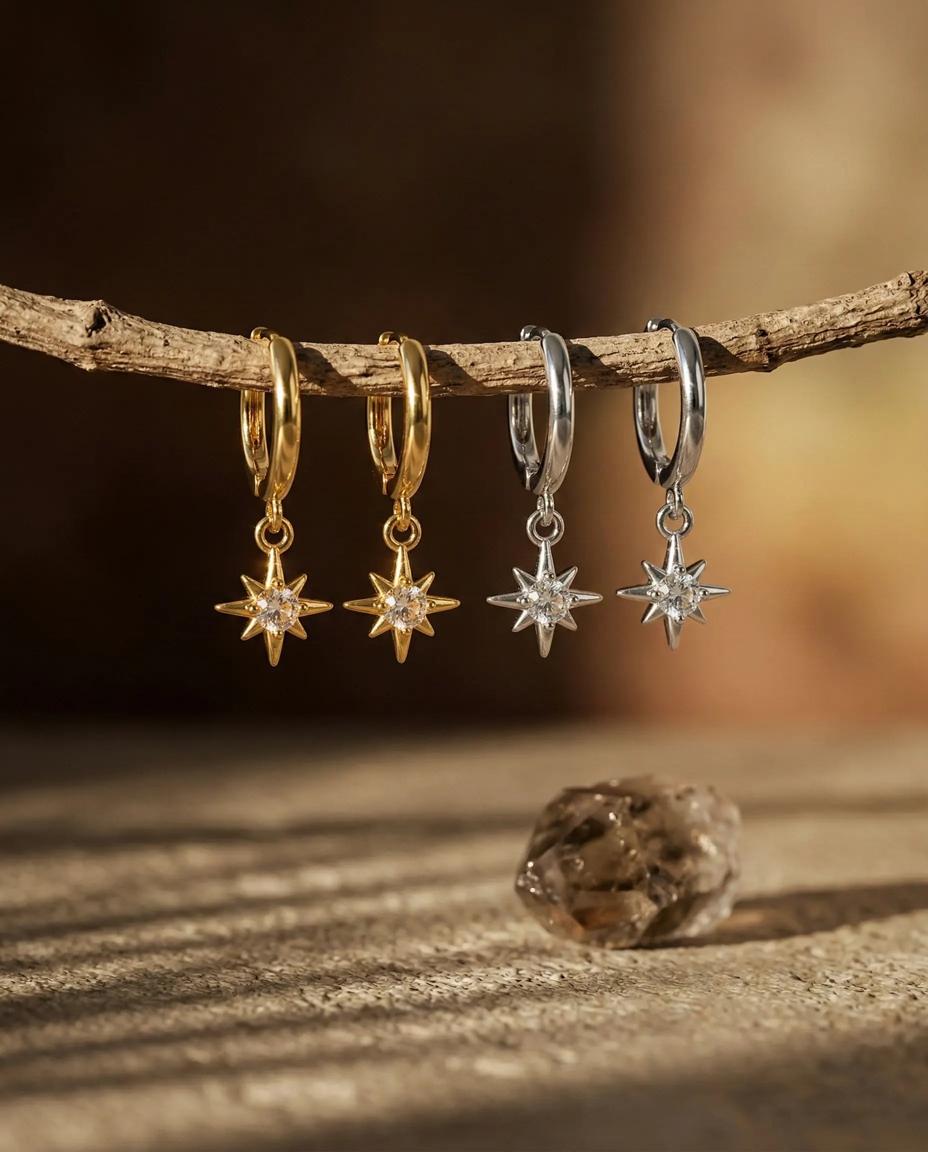 stardust-north-star-huggie-earrings-gold-silver-925-sterling, celestial-star-charm-hoops-luxury, luxury-minimalist-jewelry-aesthetic, 925-sterling-silver-earrings-europe, senya-jewelry-best-seller-stardust-collection