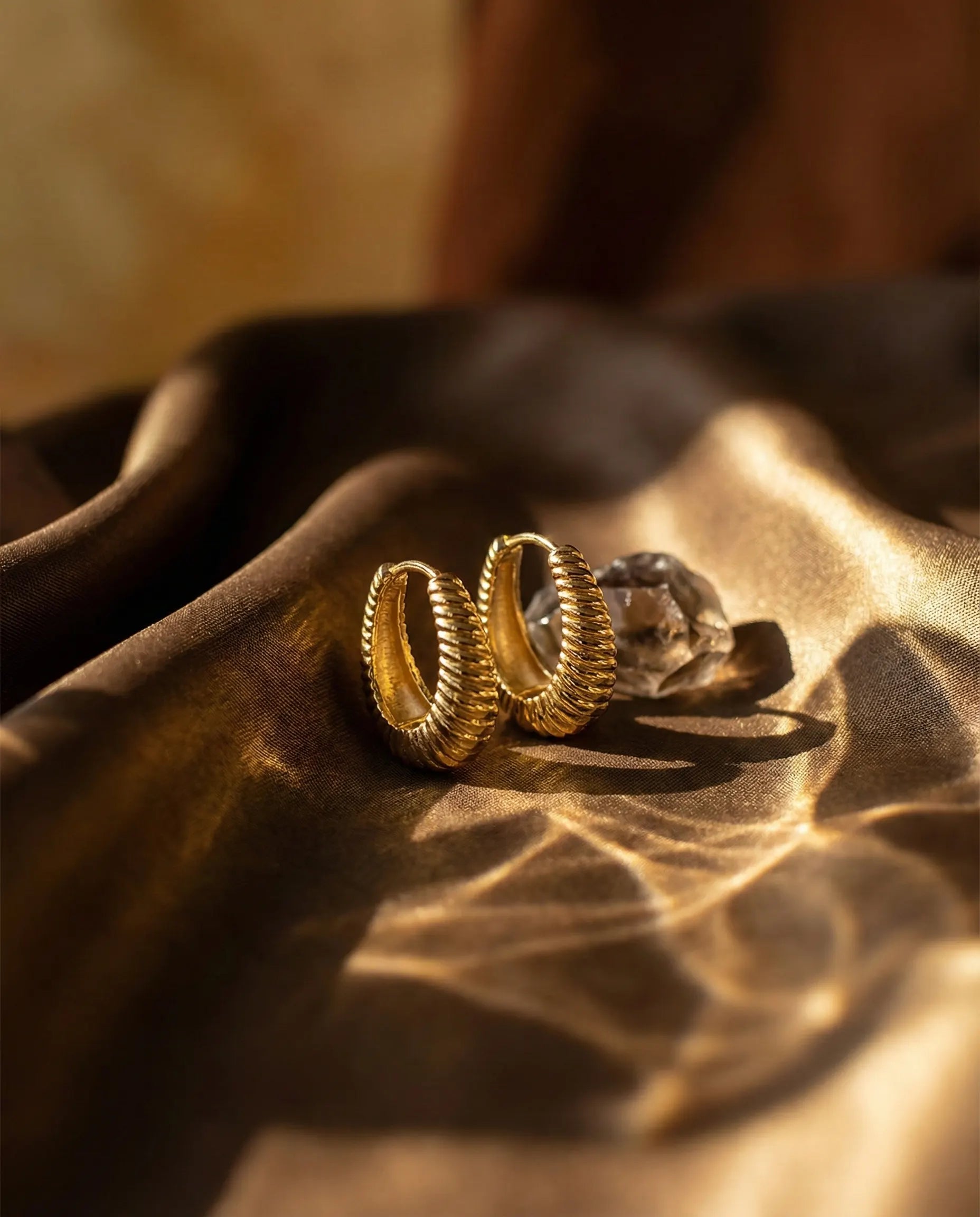 timeless-bold-aesthetic-sloane-ribbed-hoops-gold-silver, 18k-gold-plating-finish-detail-textured-earrings, gift-ideas-for-women-elegant-gold-jewelry, luxury-boutique-jewelry-styling-europe