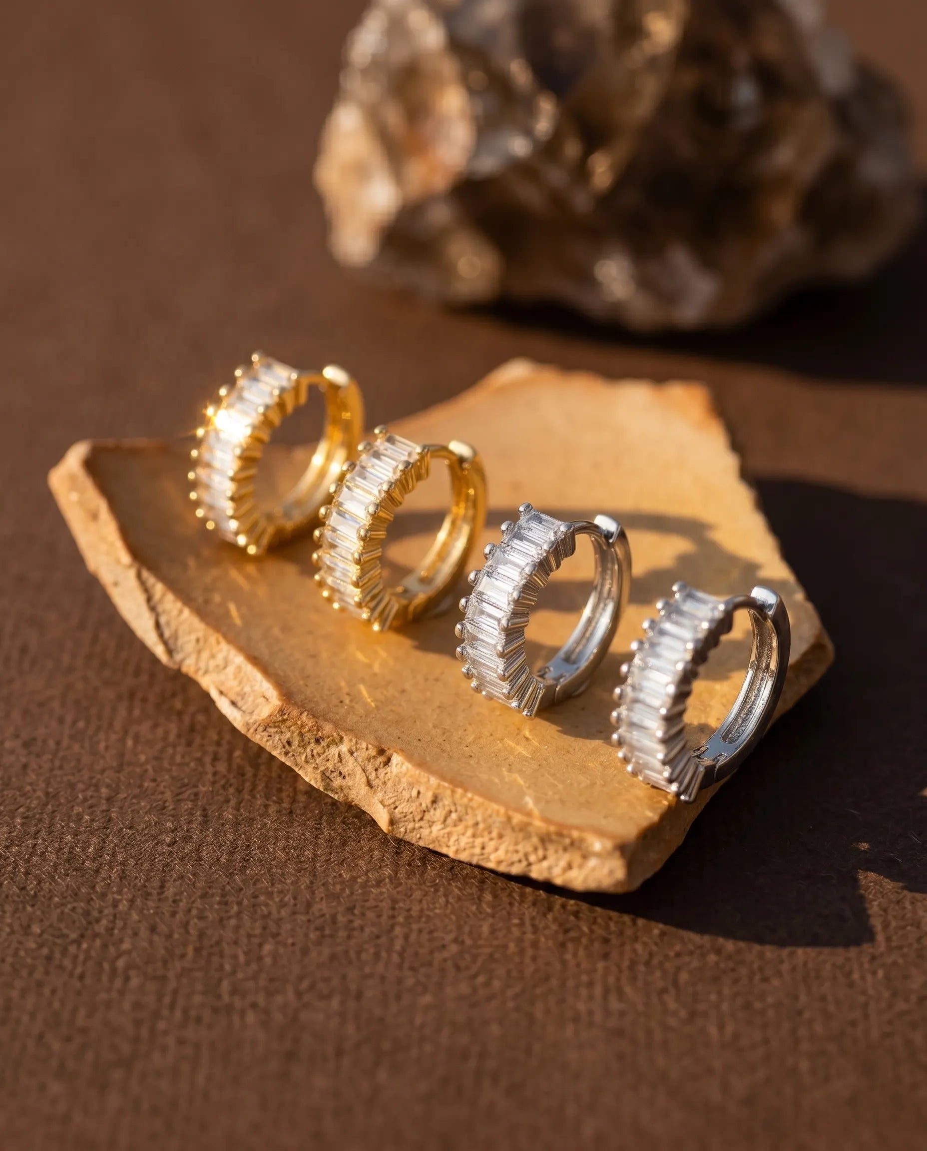 timeless-minimalist-aesthetic-lydia-sparkling-baguette-hoops, 18k-gold-plating-finish-detail-huggie-earrings, gift-ideas-for-women-elegant-gold-jewelry, luxury-boutique-jewelry-netherlands, artistic-jewelry-flatlay-photography